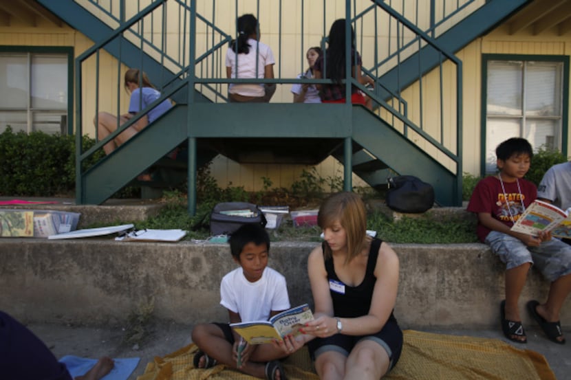 Ashley Nick, a fifth-grade teacher from Wallace Elementary in Richardson, helps fifth-grader...