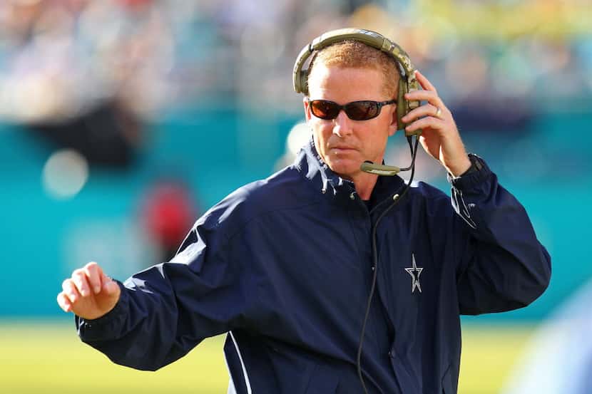 MIAMI GARDENS, FL - NOVEMBER 22:  Head coach Jason Garrett of the Dallas Cowboys signals...