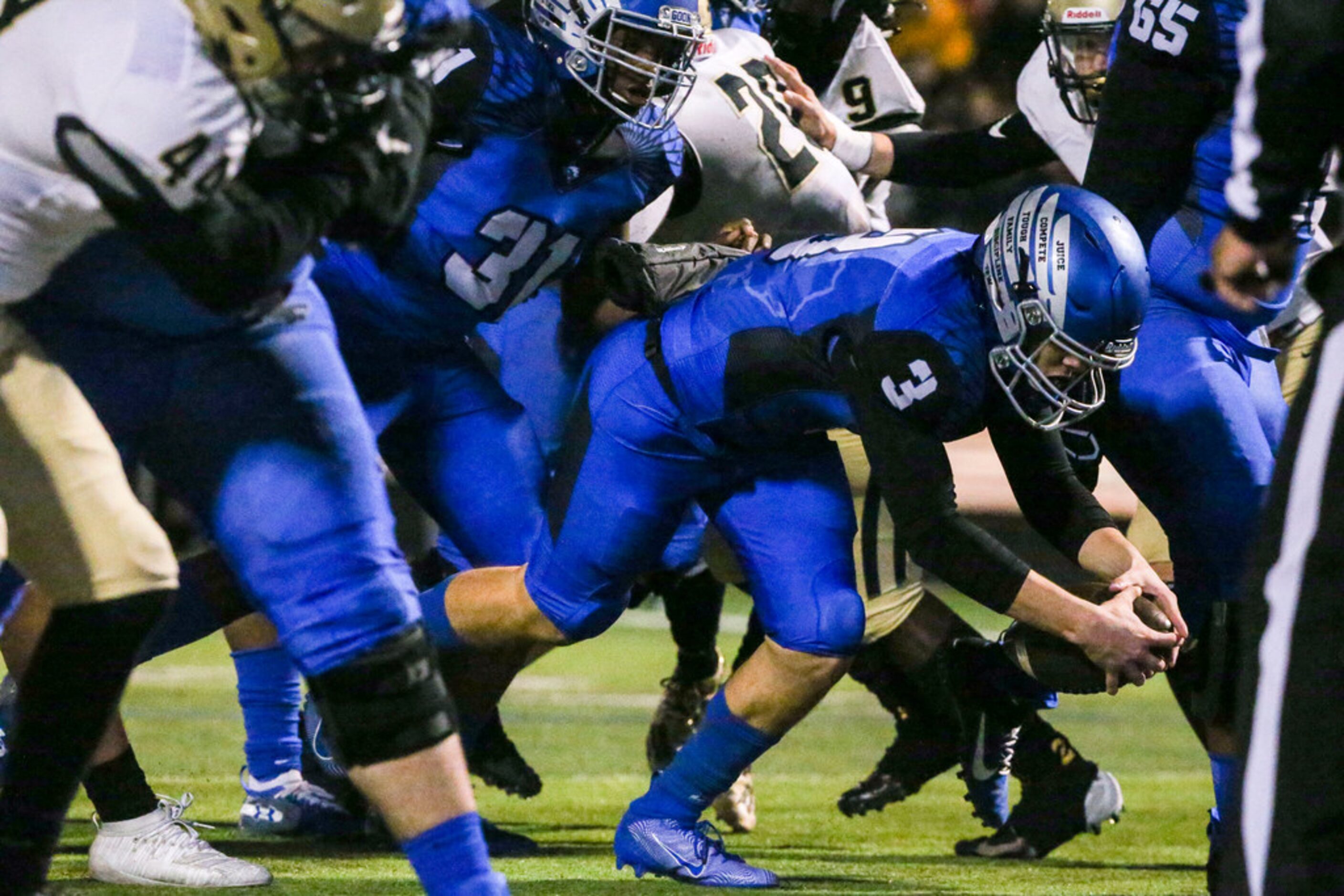 North Forney quarterback Jacob Acuna (3) scores a touchdown during a high school football...