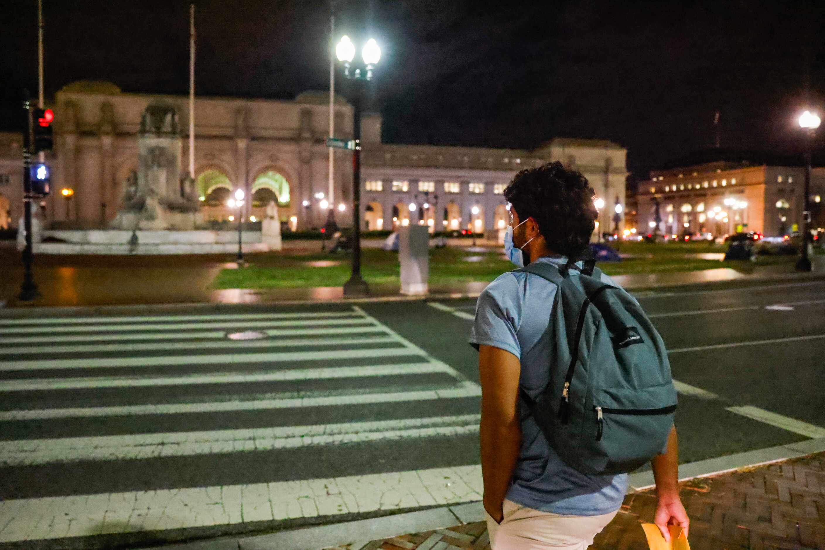 Victor Rodriguez, 26, crosses the Columbus Circle Northeast towards Union Station in...