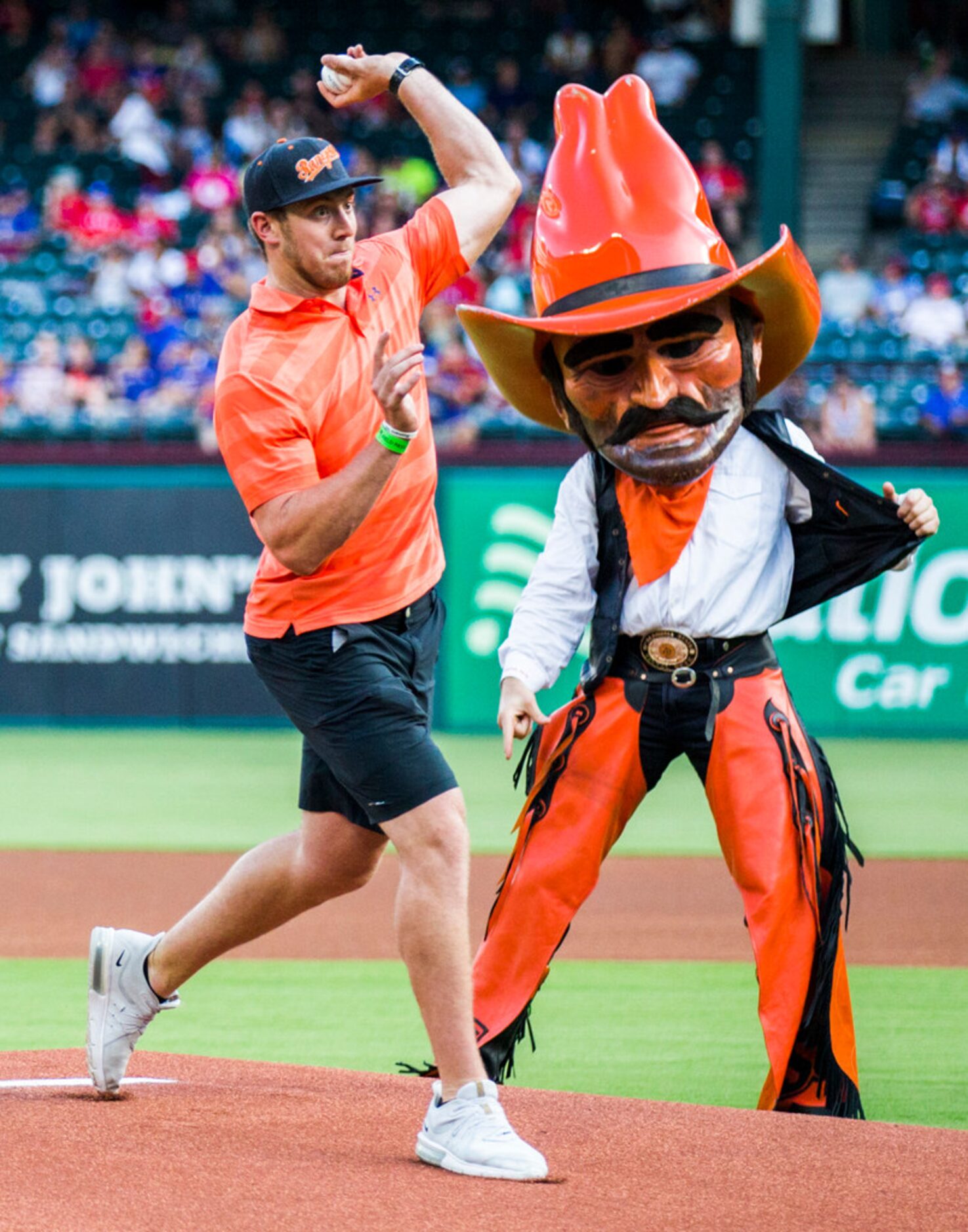 Dallas Cowboys tight end Blake Jarwin throws out the first pitch before an MLB game between...