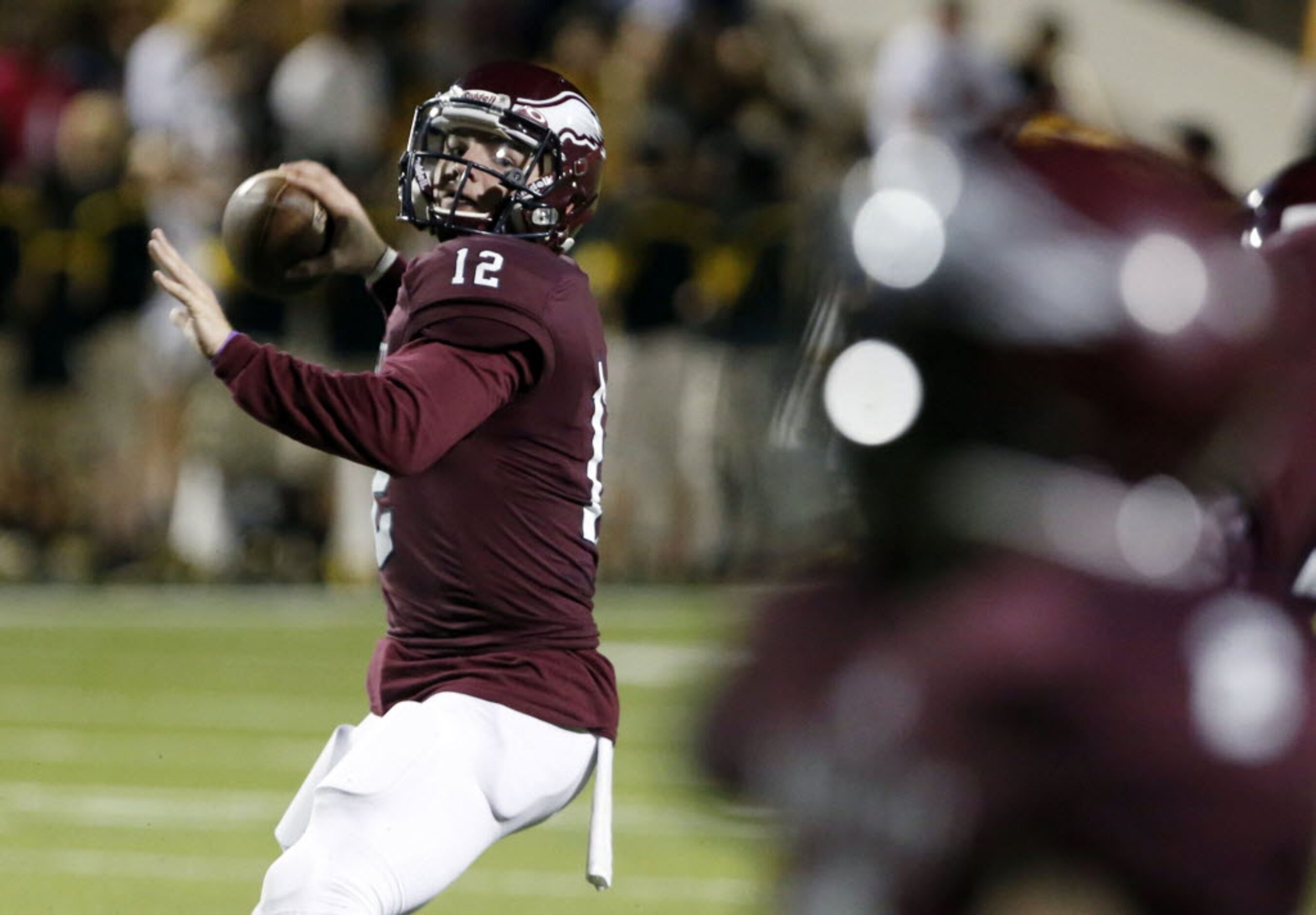 (TXHSFB) Rowlett QB Logan Bonner (12) throws a pass during the first half of a high school...