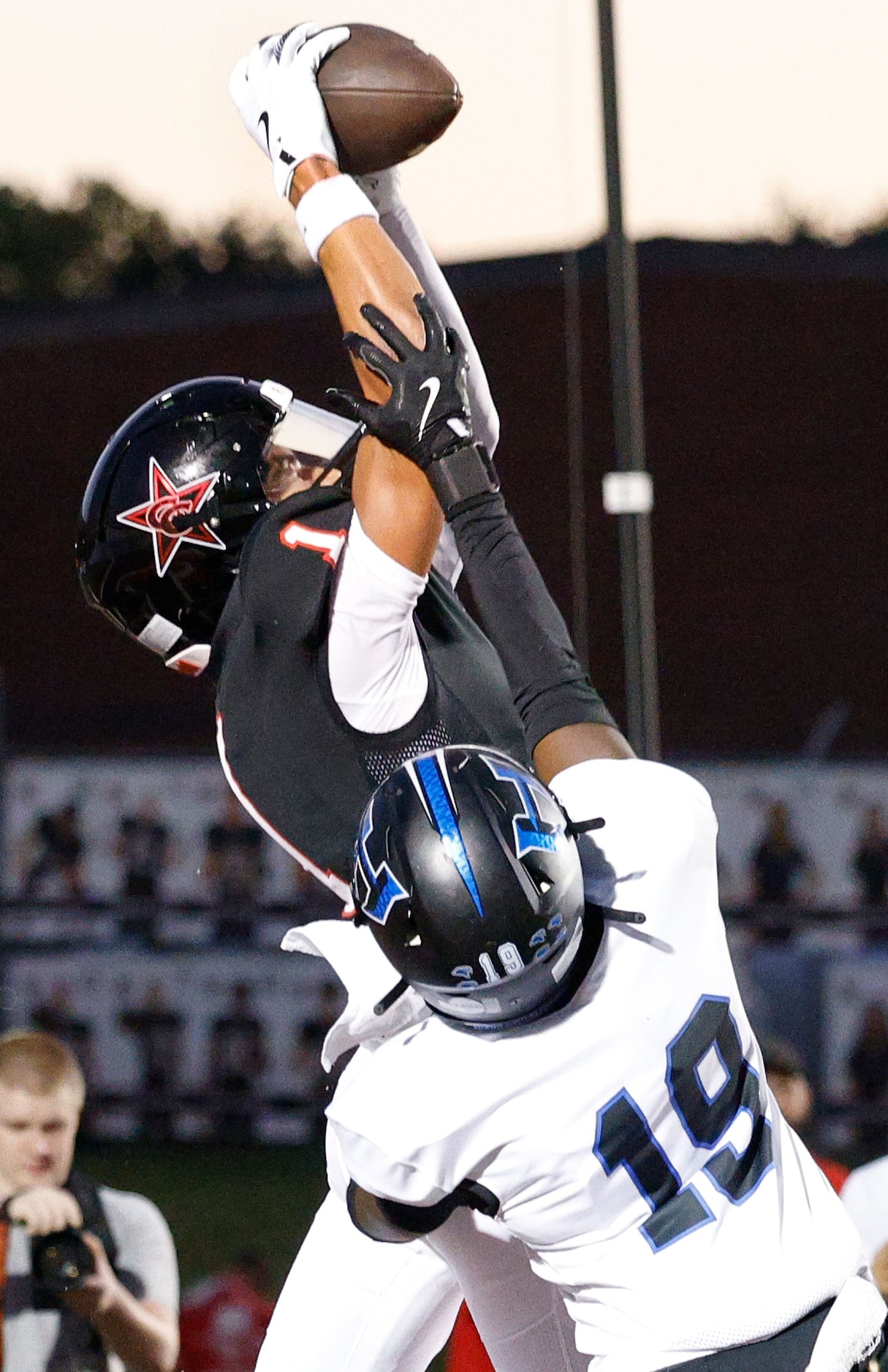 Coppell's Tucker Cusano (1) catches a pass against Hebron's Kylan Smart (19) and scores a...