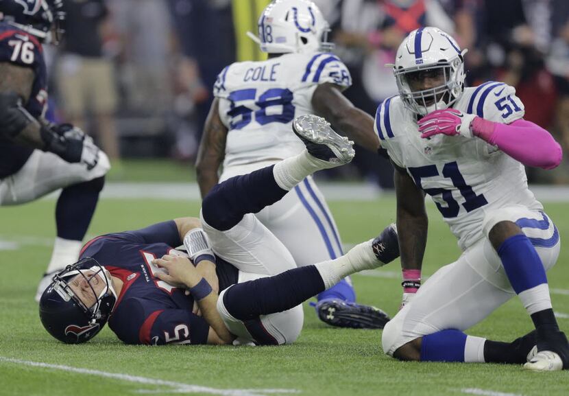 Houston Texans' Ryan Mallett (15) reacts after a late hit from Indianapolis Colts' Sio Moore...