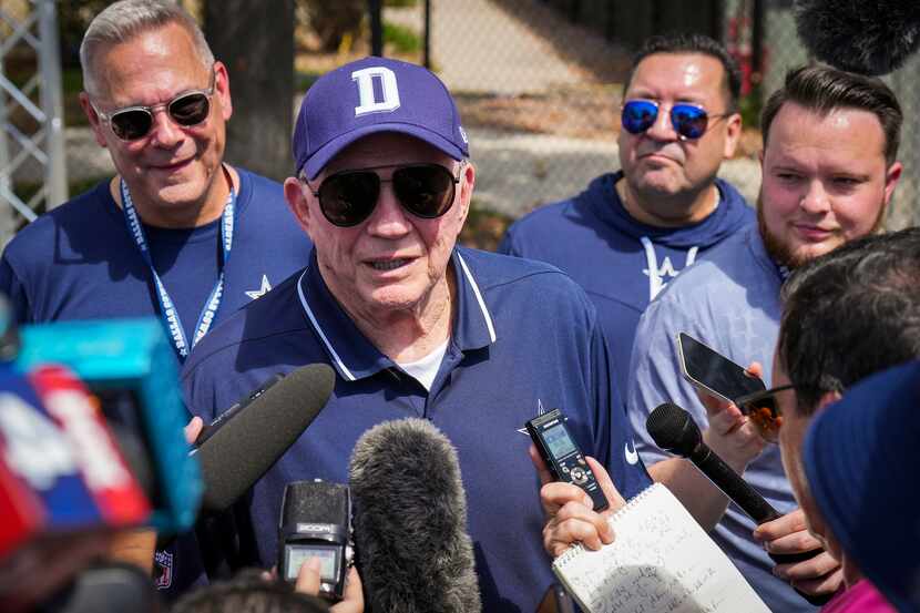 Dallas Cowboys owner and general manager Jerry Jones talks with reporters following a...