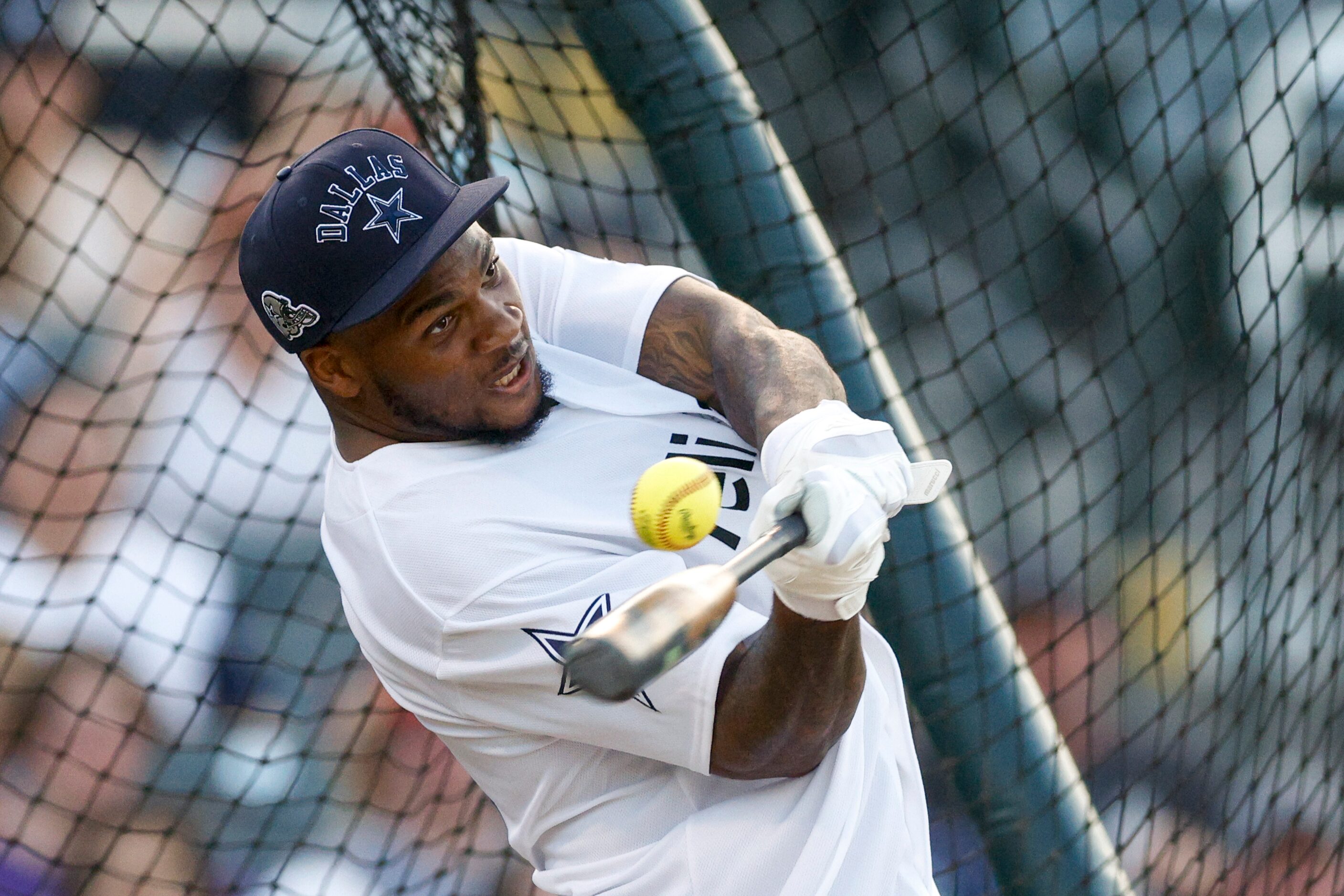 Dallas Cowboys linebacker Micah Parsons fouls off a pitch during the Reliant Energy Home Run...