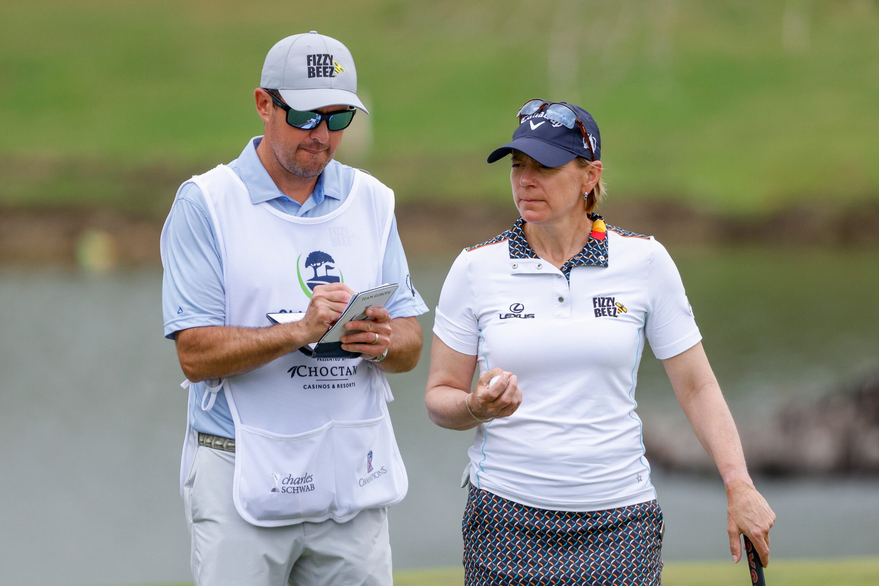 Professional golfer Annika Sorenstam talks with her caddie during the ClubCorp Classic...