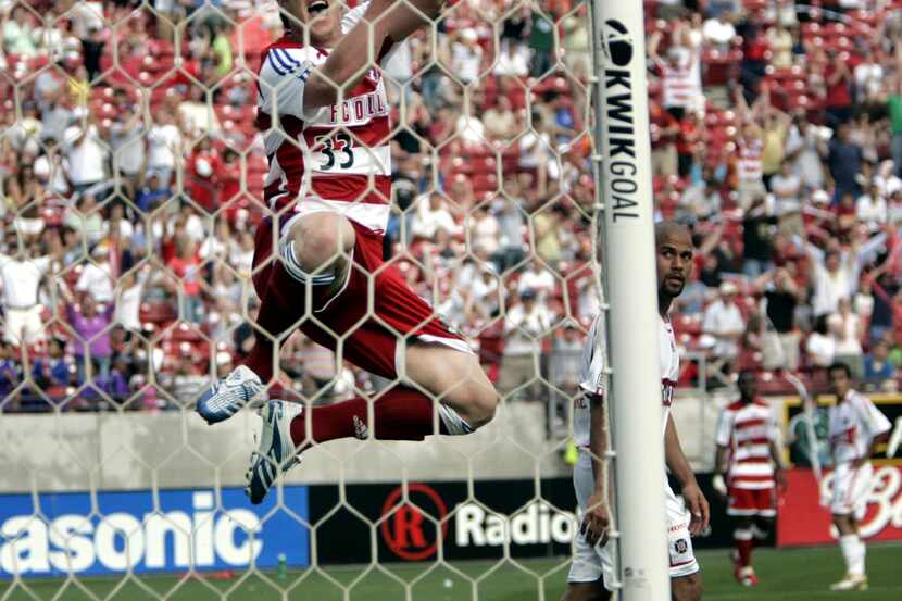 FC Dallas' Kenny Cooper (#33) celebrates after scoring his first goal in his first MLS...