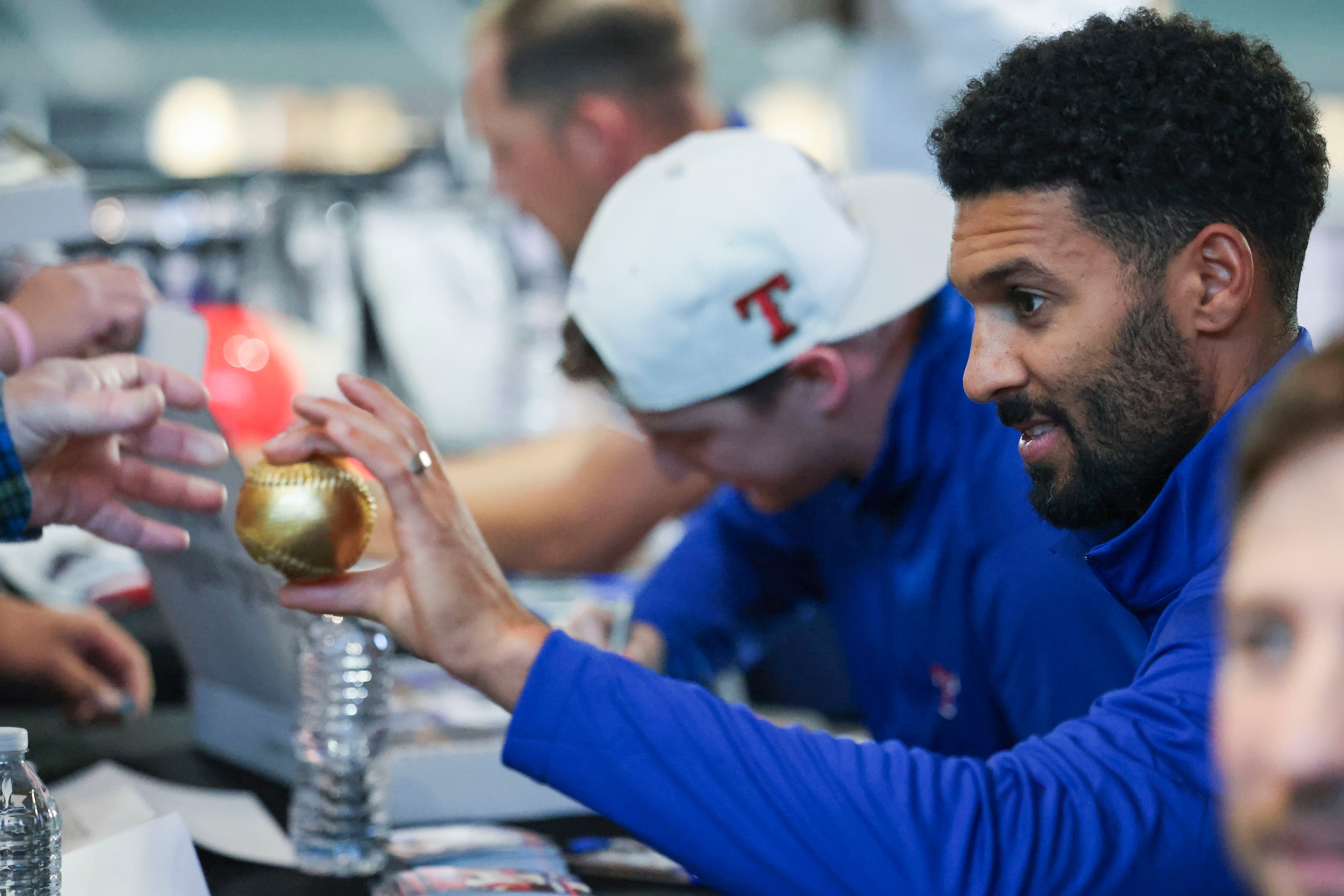 Texas Rangers second baseman Marcus Semien signs autographs during Texas Rangers Toy Drive...