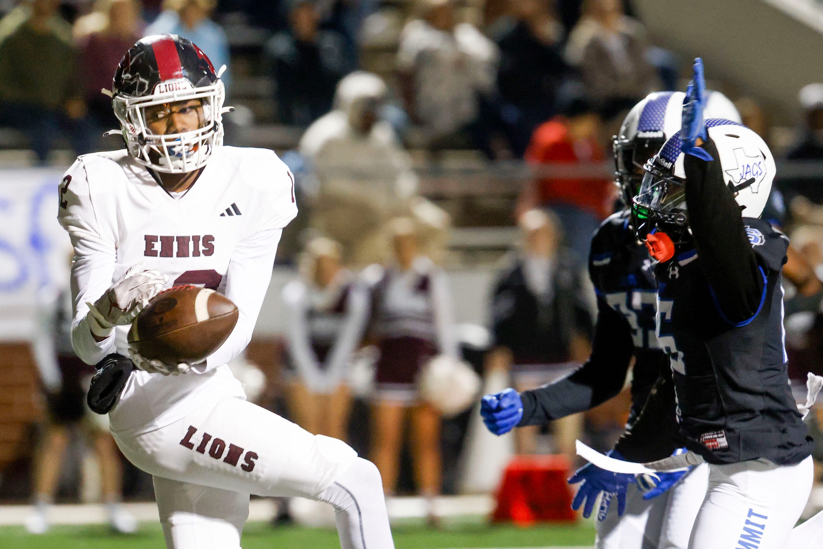 Ennis High’s Taurean Bell (12) receives a touchdown pass past Mansfield Summit high DaVaughn...