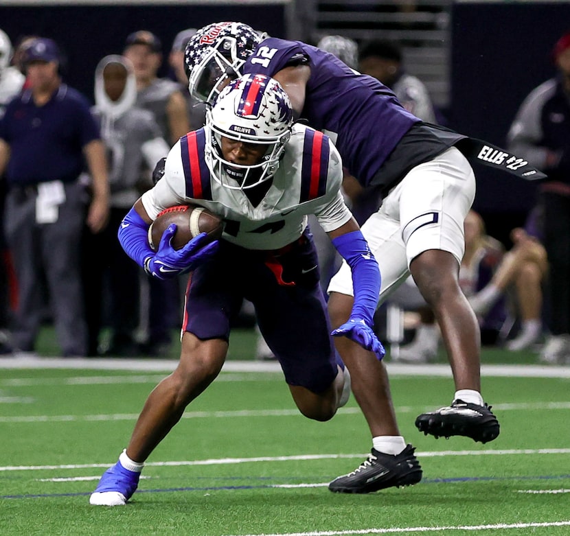 Richland wide receiver Xavier Johnson (14) comes up with a reception against Denton Ryan...