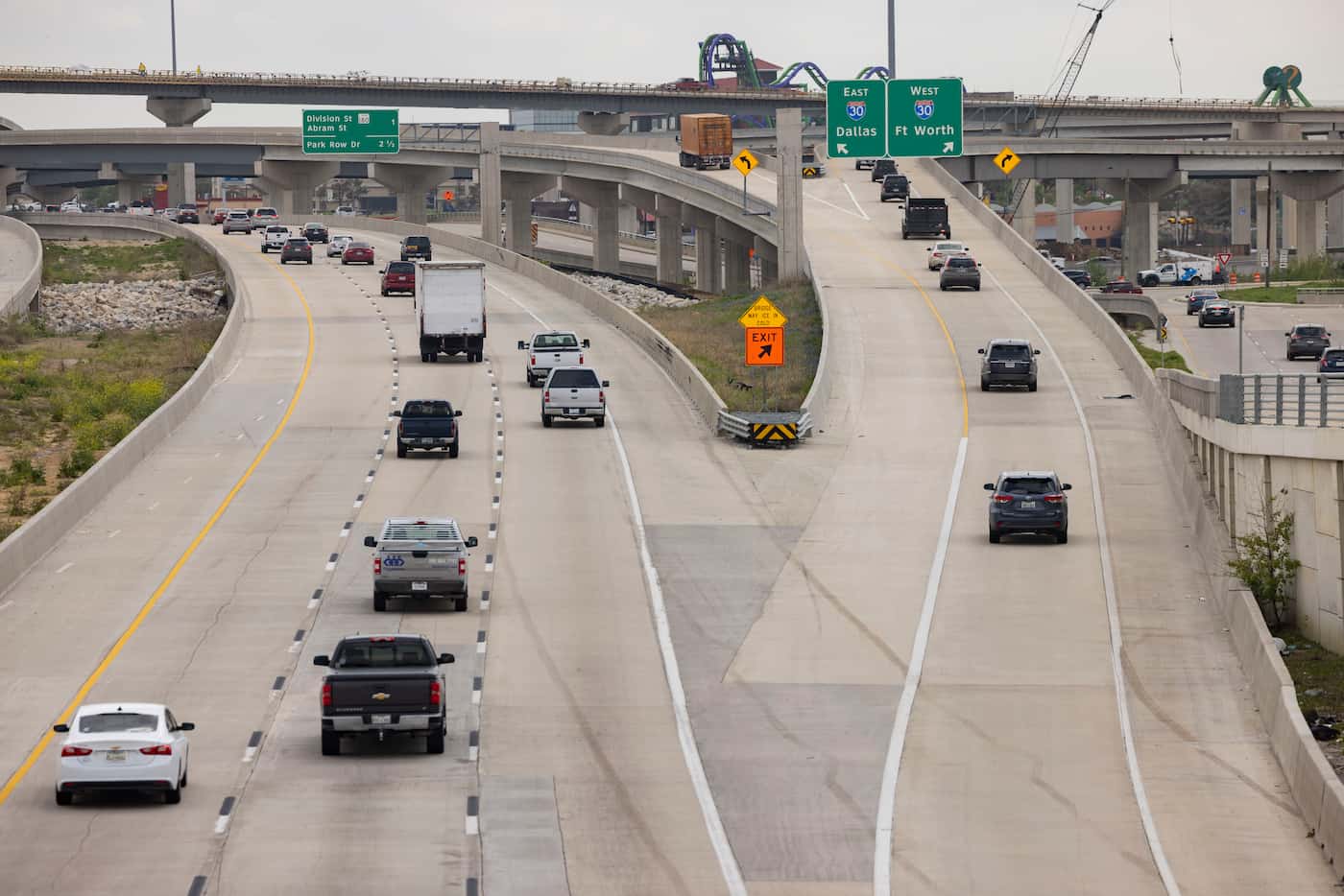 Drivers take the new flyover ramps east and westbound onto I-30 from Highway 360 south near...