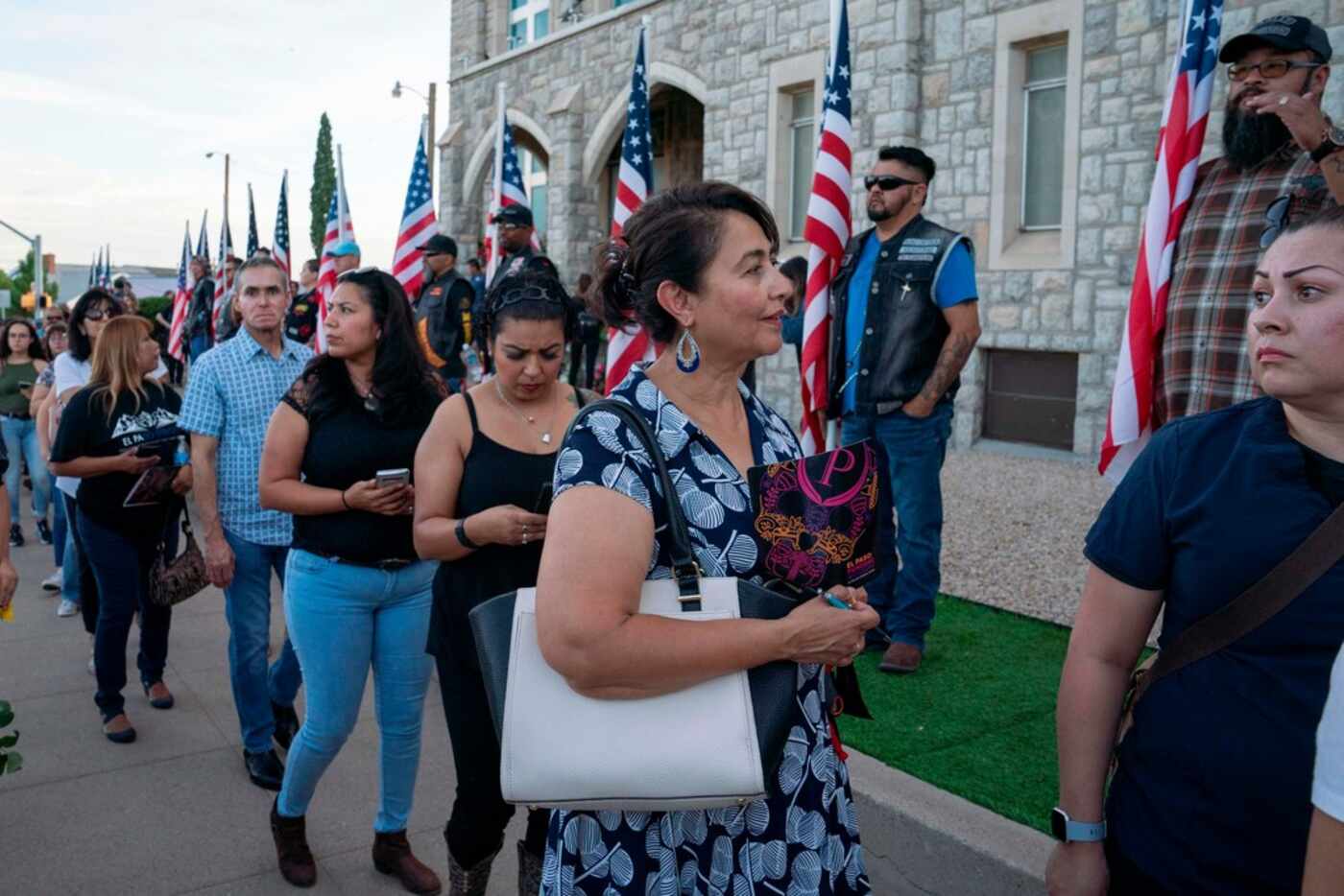 People wait in line to attend the visitation service for Margie Reckard at La Paz Faith...