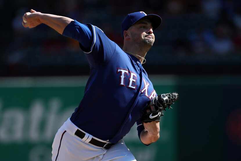 ARLINGTON, TEXAS - AUGUST 18:  Taylor Guerrieri #46 of the Texas Rangers throws against the...