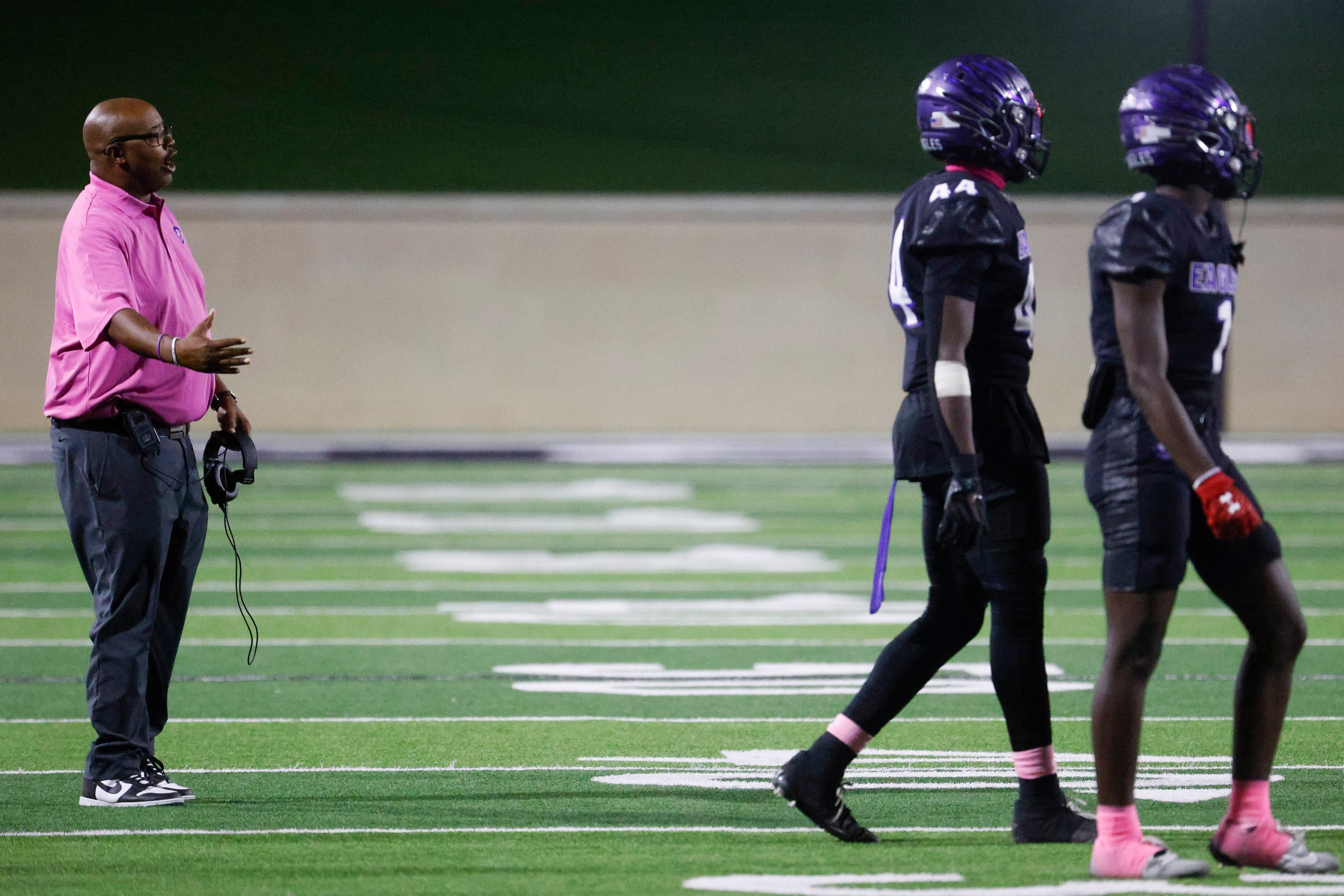 Crowley High head coach Carlos Lynn instructs the team against Trinity High during the first...