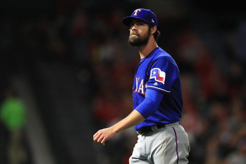 ANAHEIM, CA - APRIL 11:  Cole Hamels #35 of the Texas Rangers walks off the field at the end...