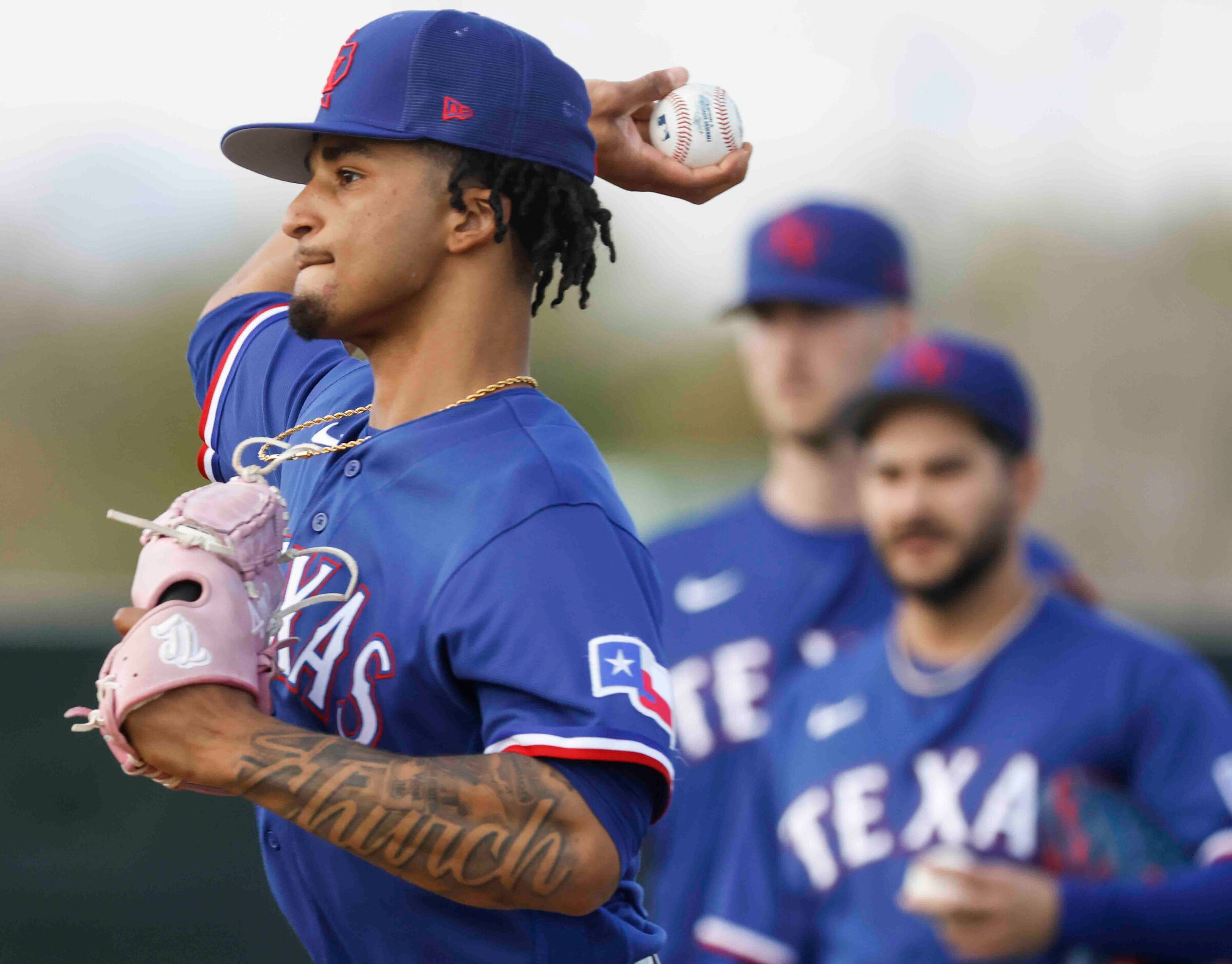 Texas Rangers pitcher Marc Church throws a pitch during a spring training workout at the...