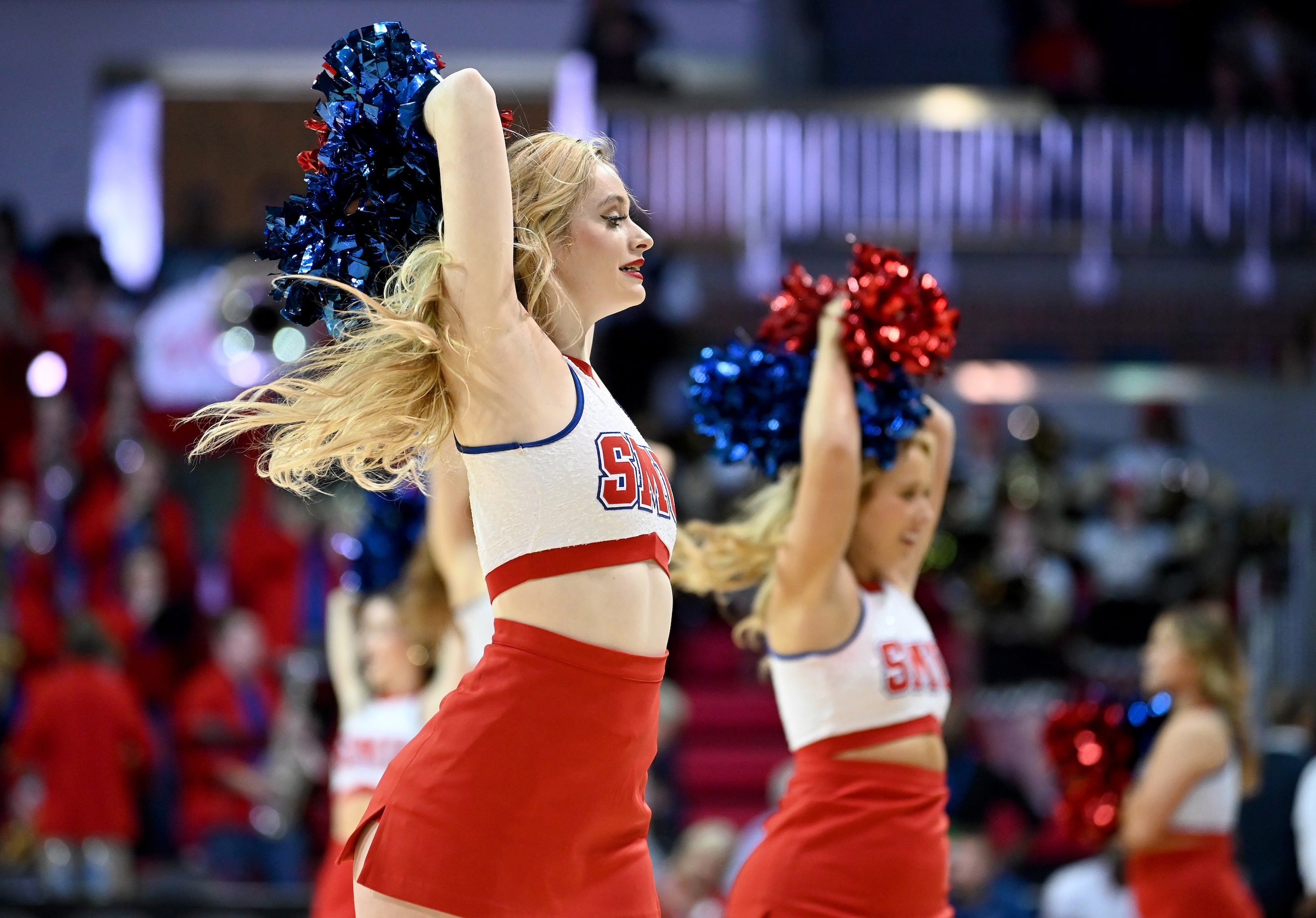 SMU cheerleaders perform during a timeout in the second half during a men’s NCAA basketball...