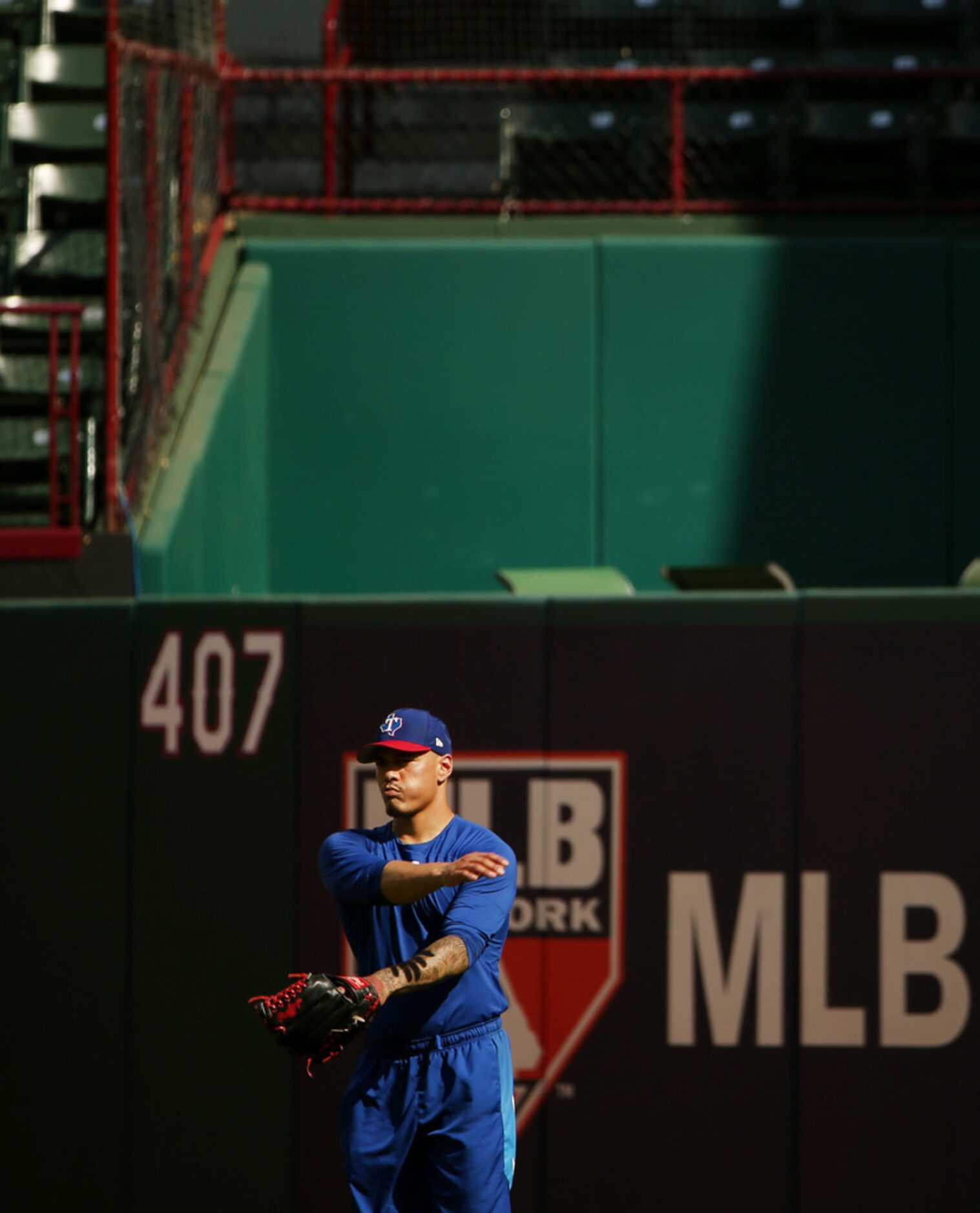 Texas Rangers relief pitcher Keone Kela (50) stretches during batting practice before a...