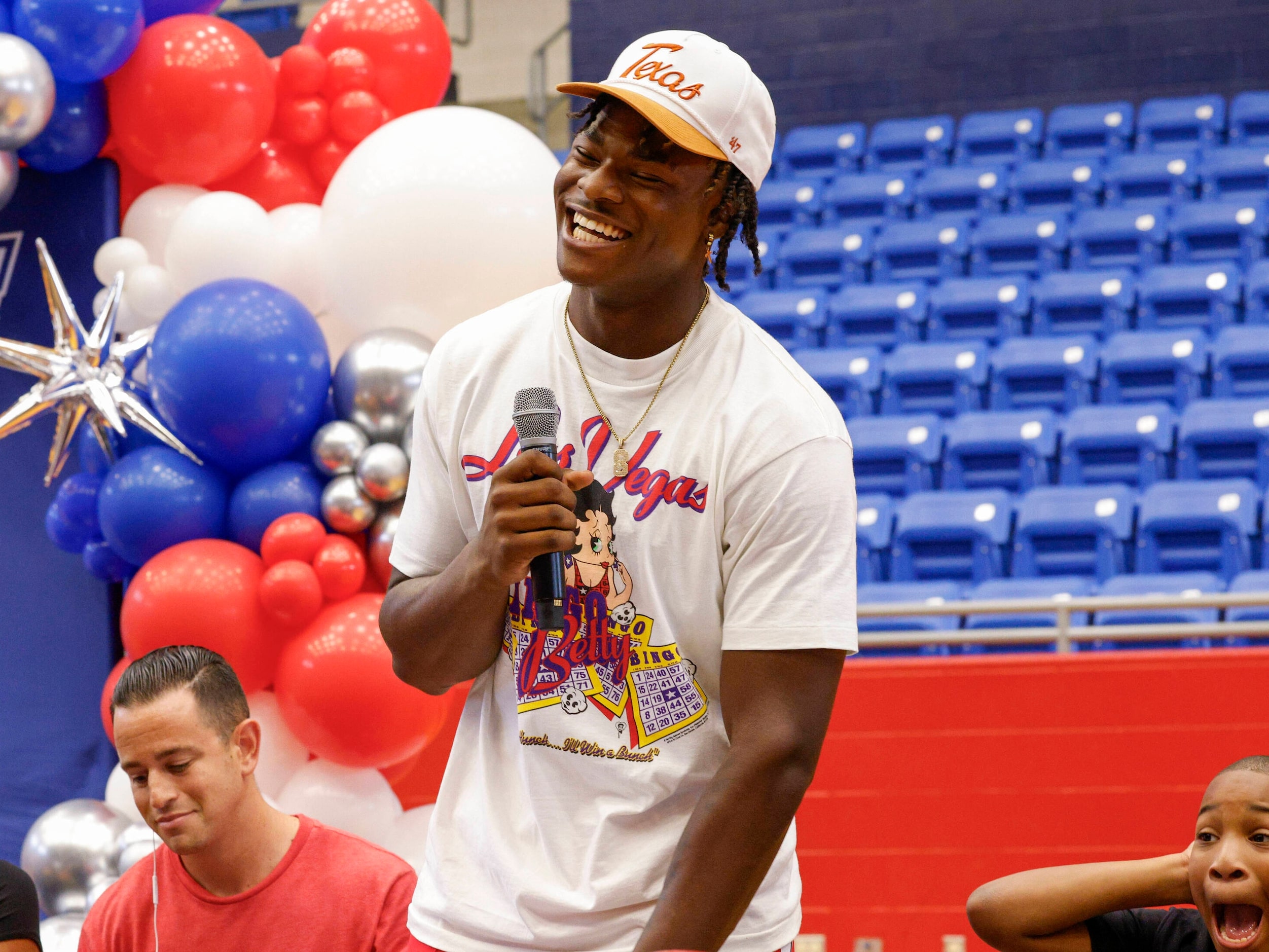 Duncanville defensive lineman Colin Simmons stands as he announces he will be attending the...