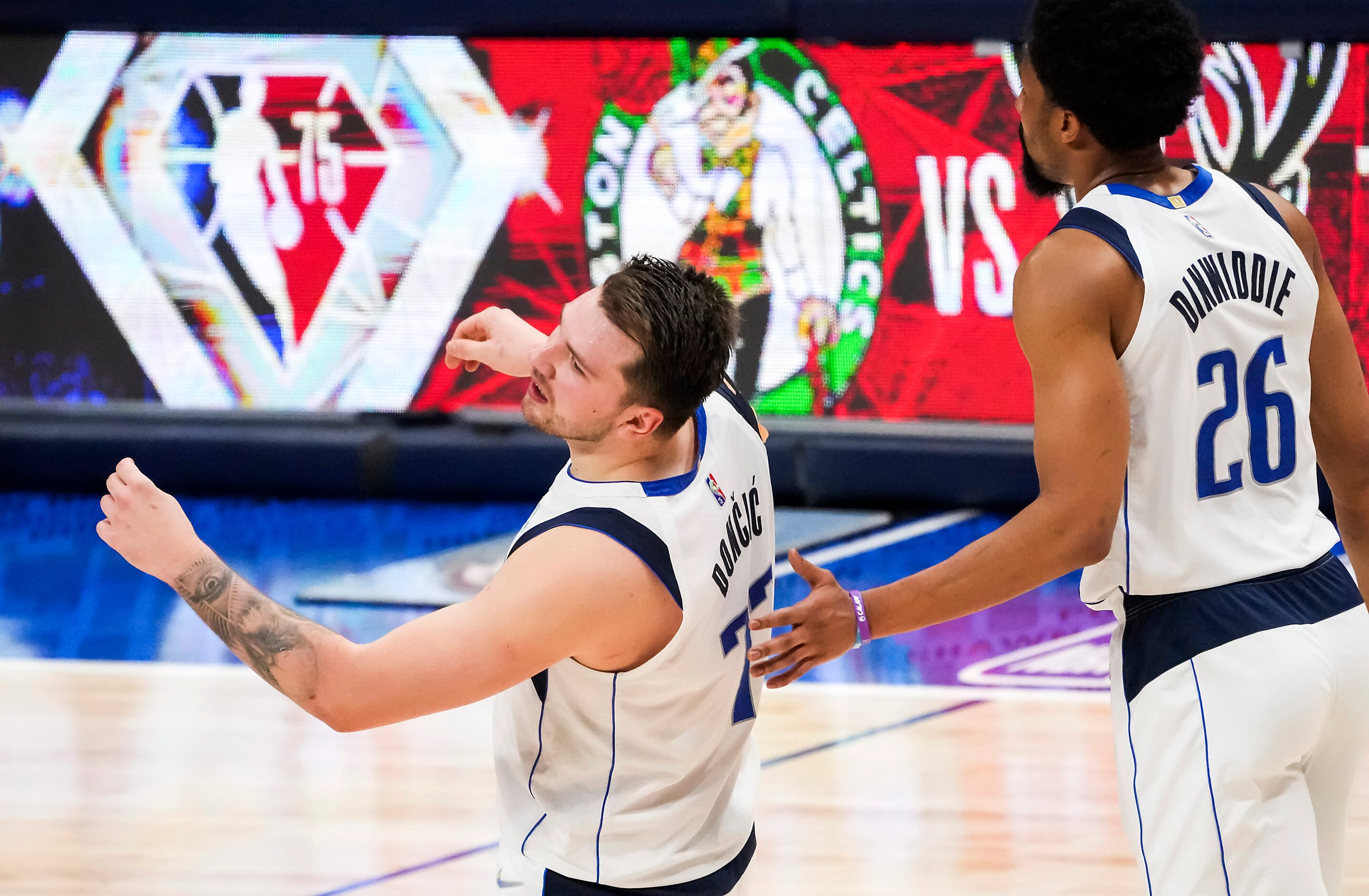 Dallas Mavericks guard Luka Doncic (77) reacts after he was called for an offensive foul...