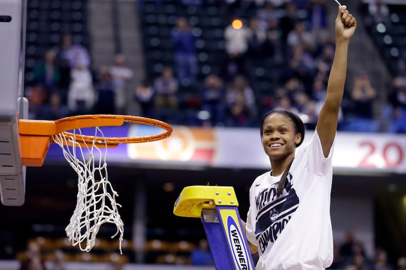 Connecticut's Moriah Jefferson (4) celebrates by cutting down the net after Connecticut's...