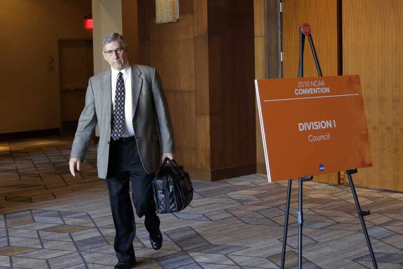 Big 12 Commissioner Bob Bowlsby departs a closed-door meeting at  the NCAA Convention where...