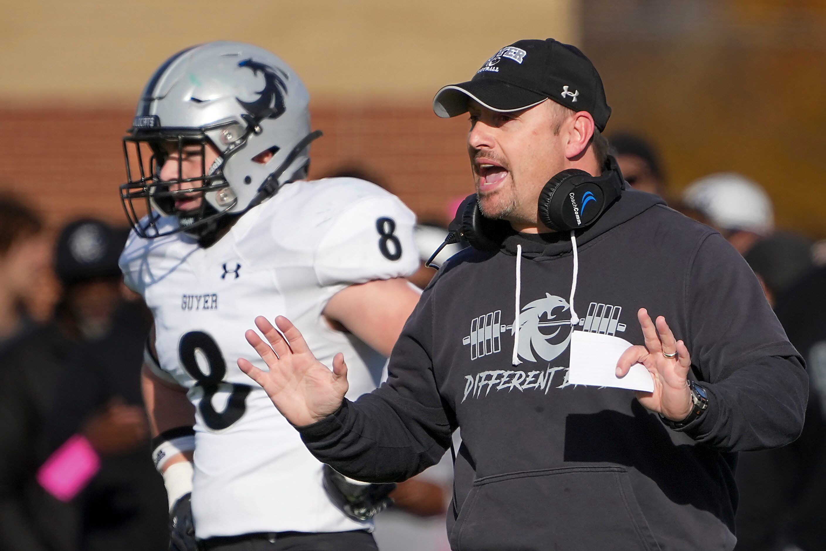 Denton Guyer head coach Reed Heim directs his team from the sidelines during the first half...