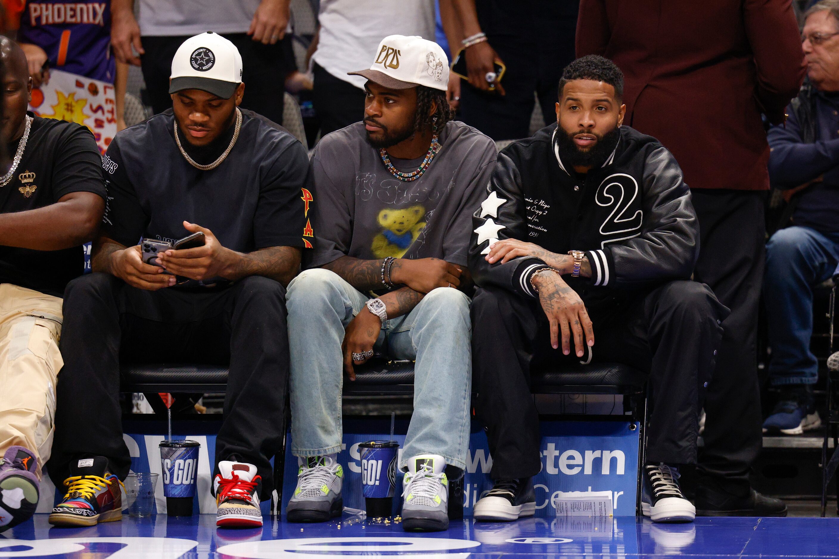 Dallas Cowboys players Micah Parsons (left), Trevon Diggs (center) and NFL free agent Odell...