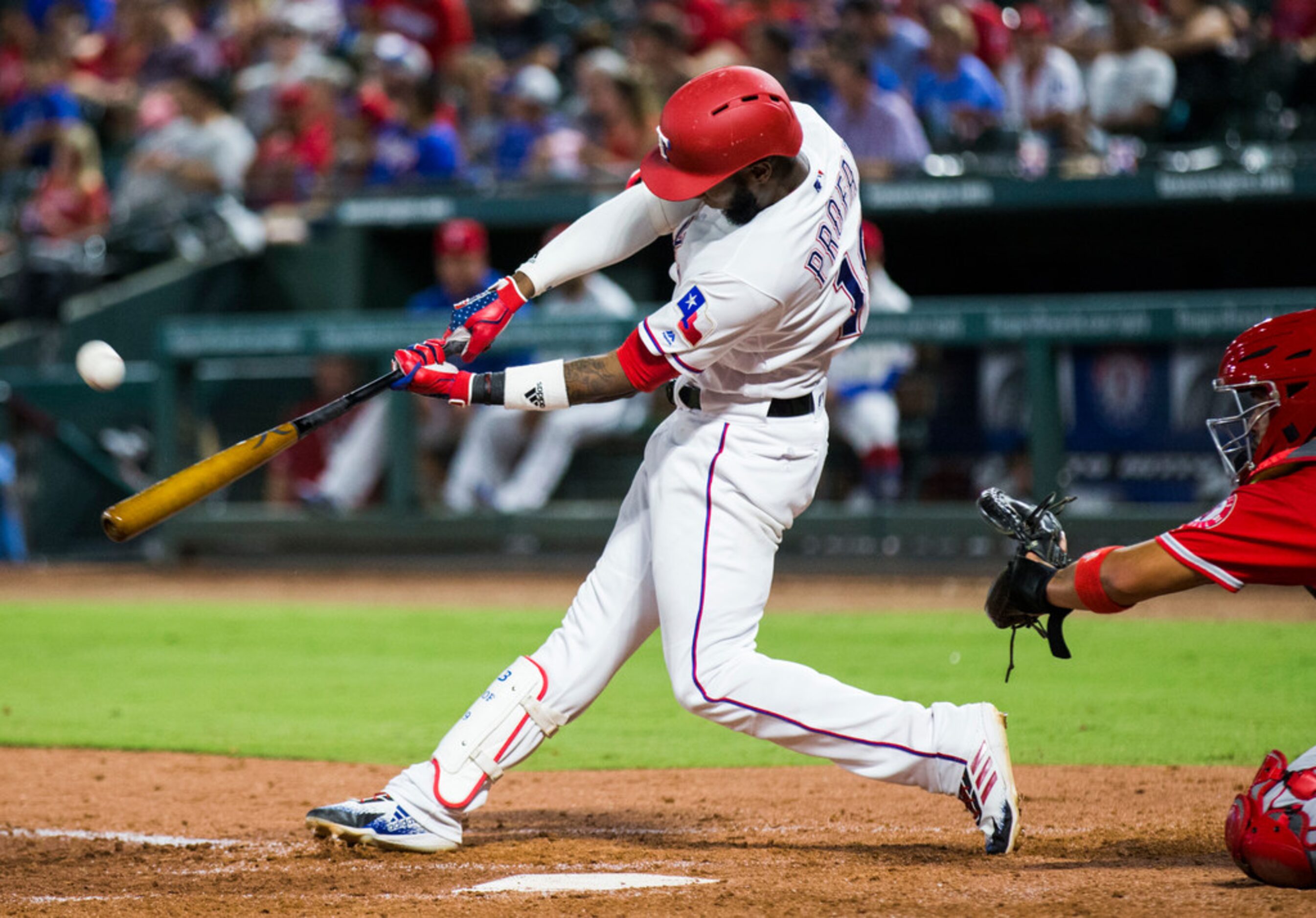 Texas Rangers shortstop Jurickson Profar (19) hits a home run during the sixth inning of an...