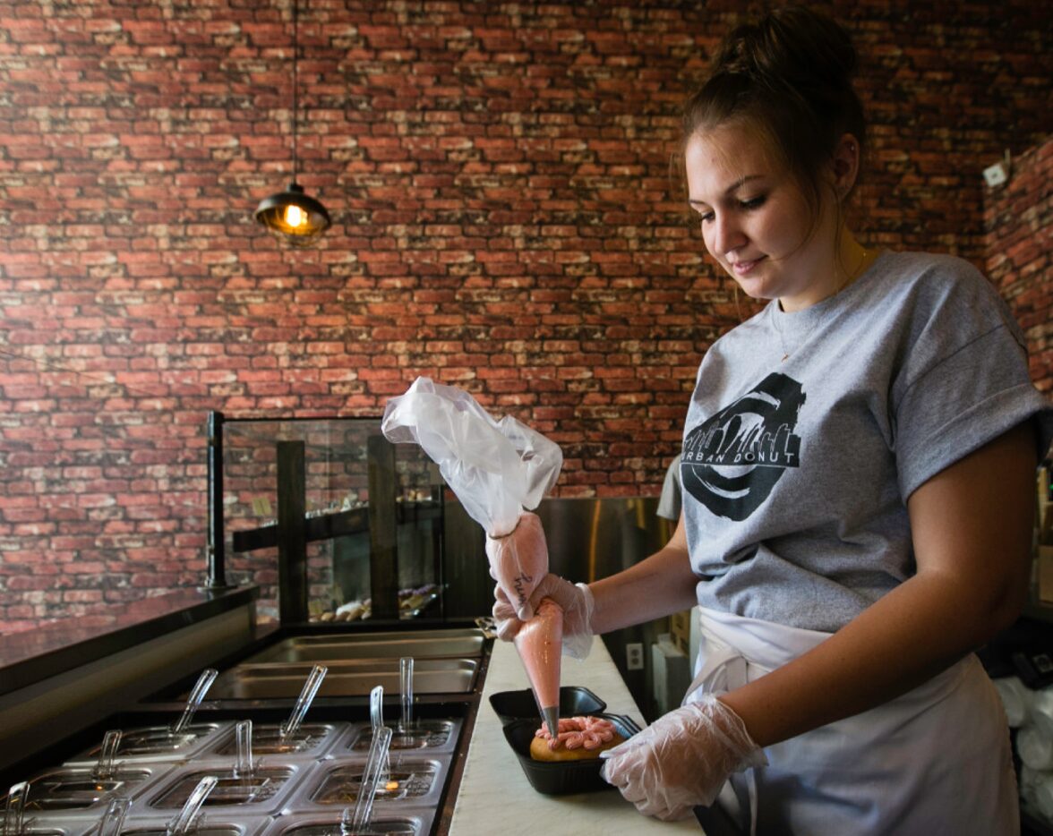 Hanna Kattilakoski makes a Selfie, a donut you can customize, at Urban Donut in Dallas. The...