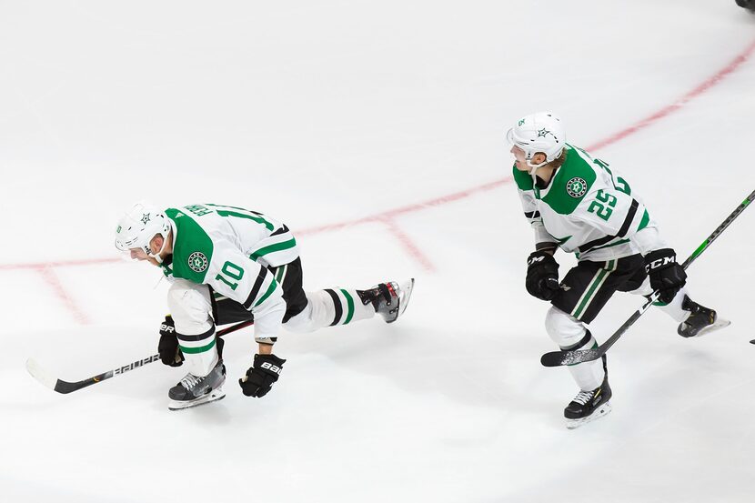 Corey Perry (10) and Joel Kiviranta (25) of the Stars celebrate Perry's game-winning goal...