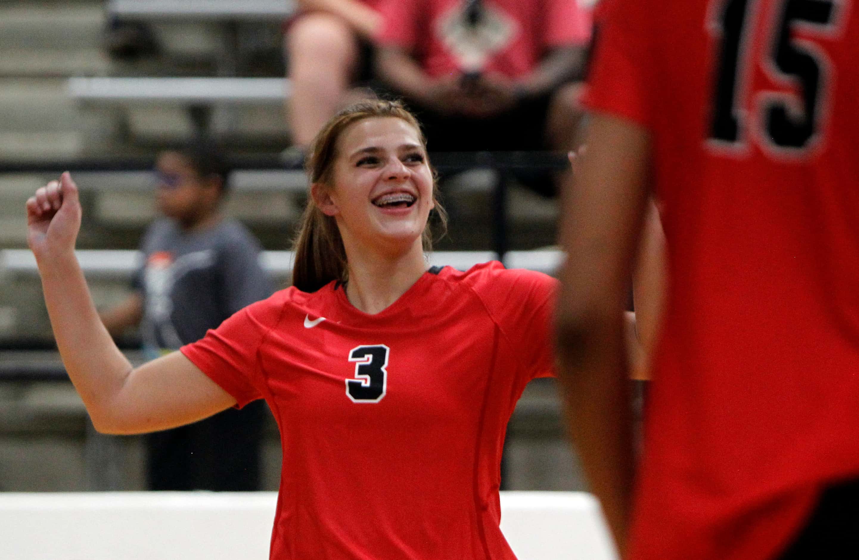 Arlington Martin's Zella Baresh (3) reacts after scoring during the 3rd set of their...
