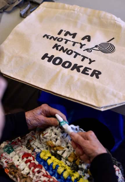 Joan Jackson brings her custom bag to the center for her volunteer work with the Happy Hookers.