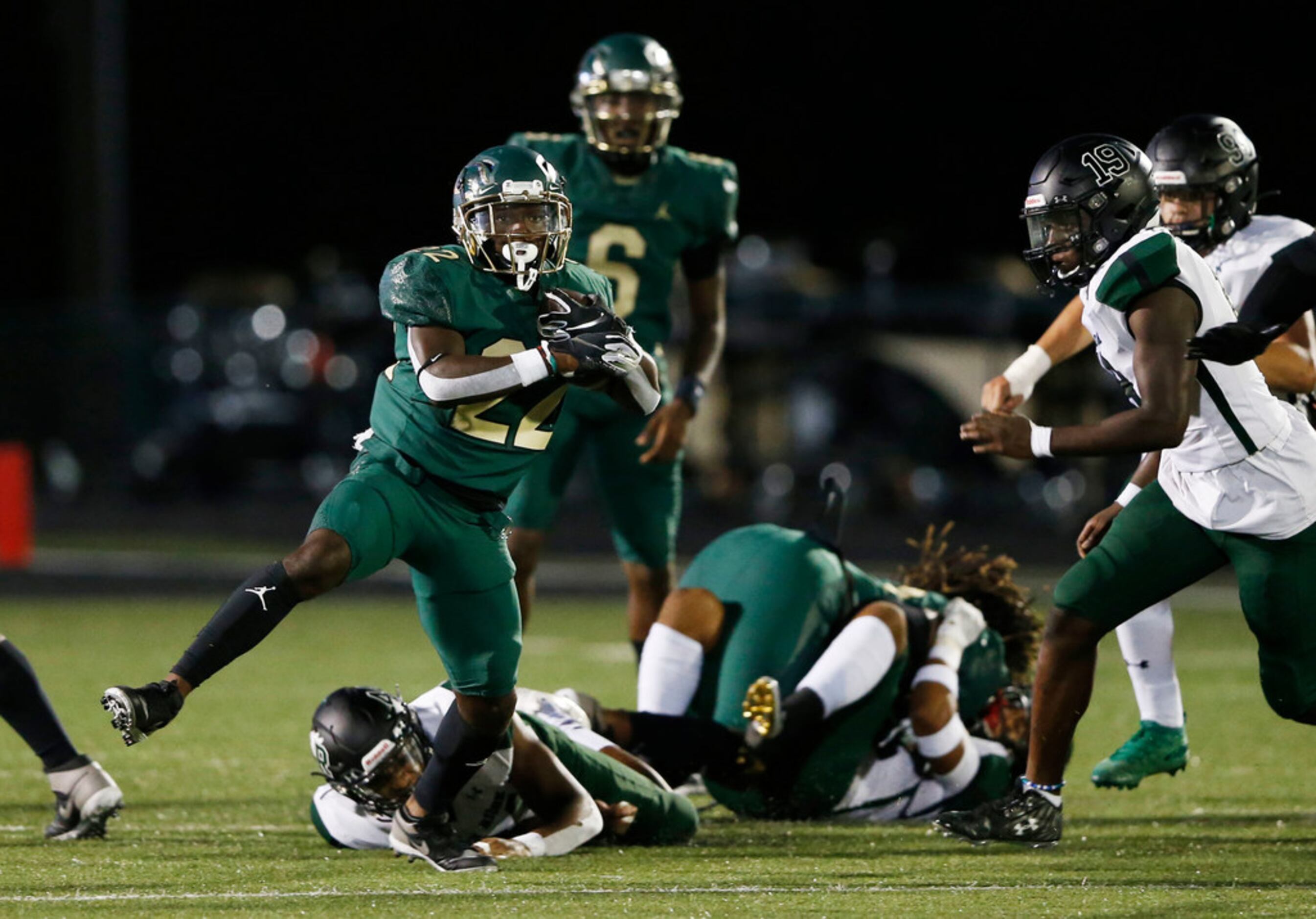 DeSoto's Jyison Brown (22) breaks for a long rushing play in a game against Mansfield Lake...