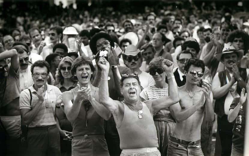 Supporters applaud a speaker in Lee Park after the pride parade on June 19, 1983. 