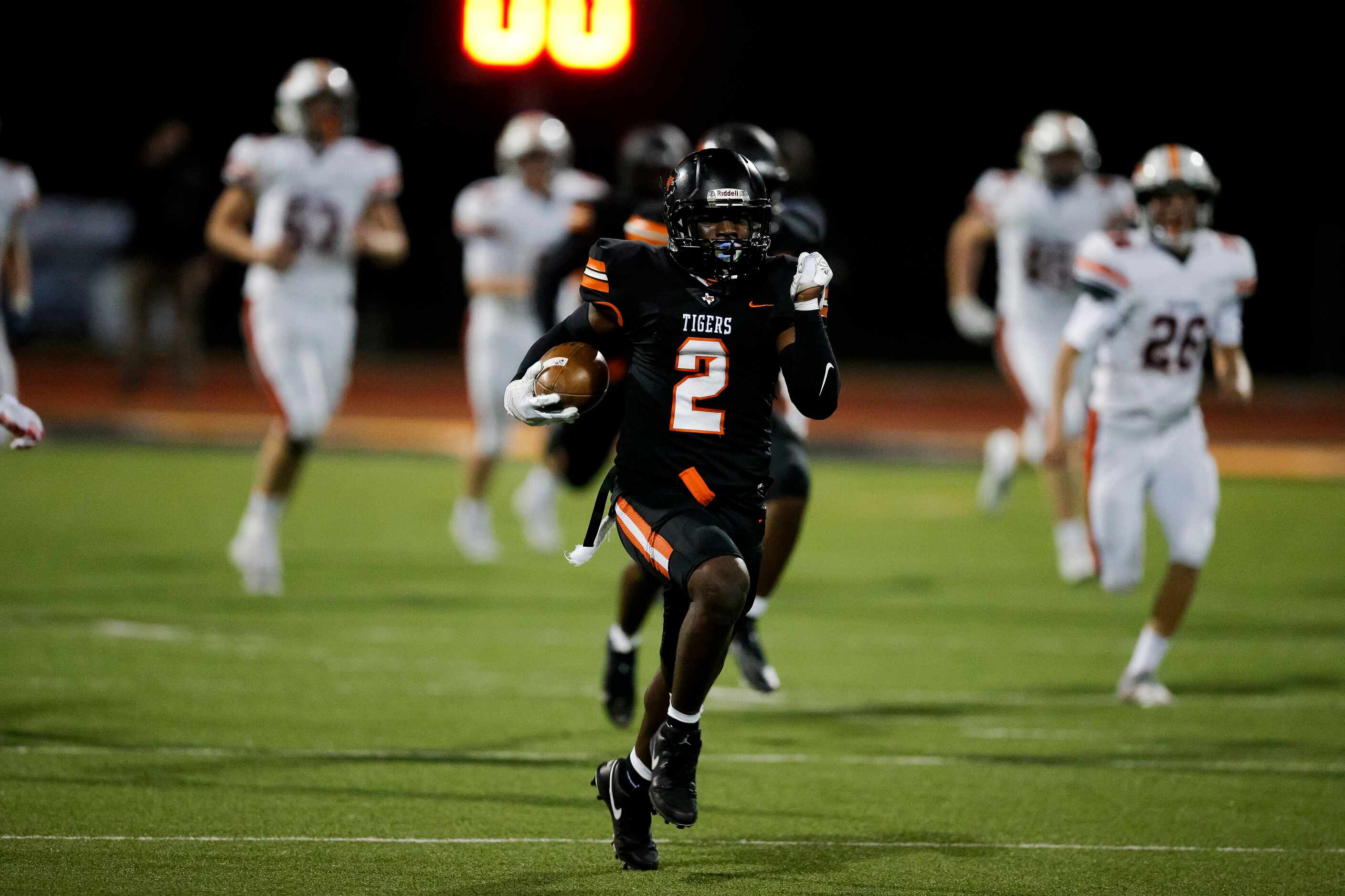 Lancaster senior defensive back Davion Hodge (2) returns a blocked field goal attempt by...