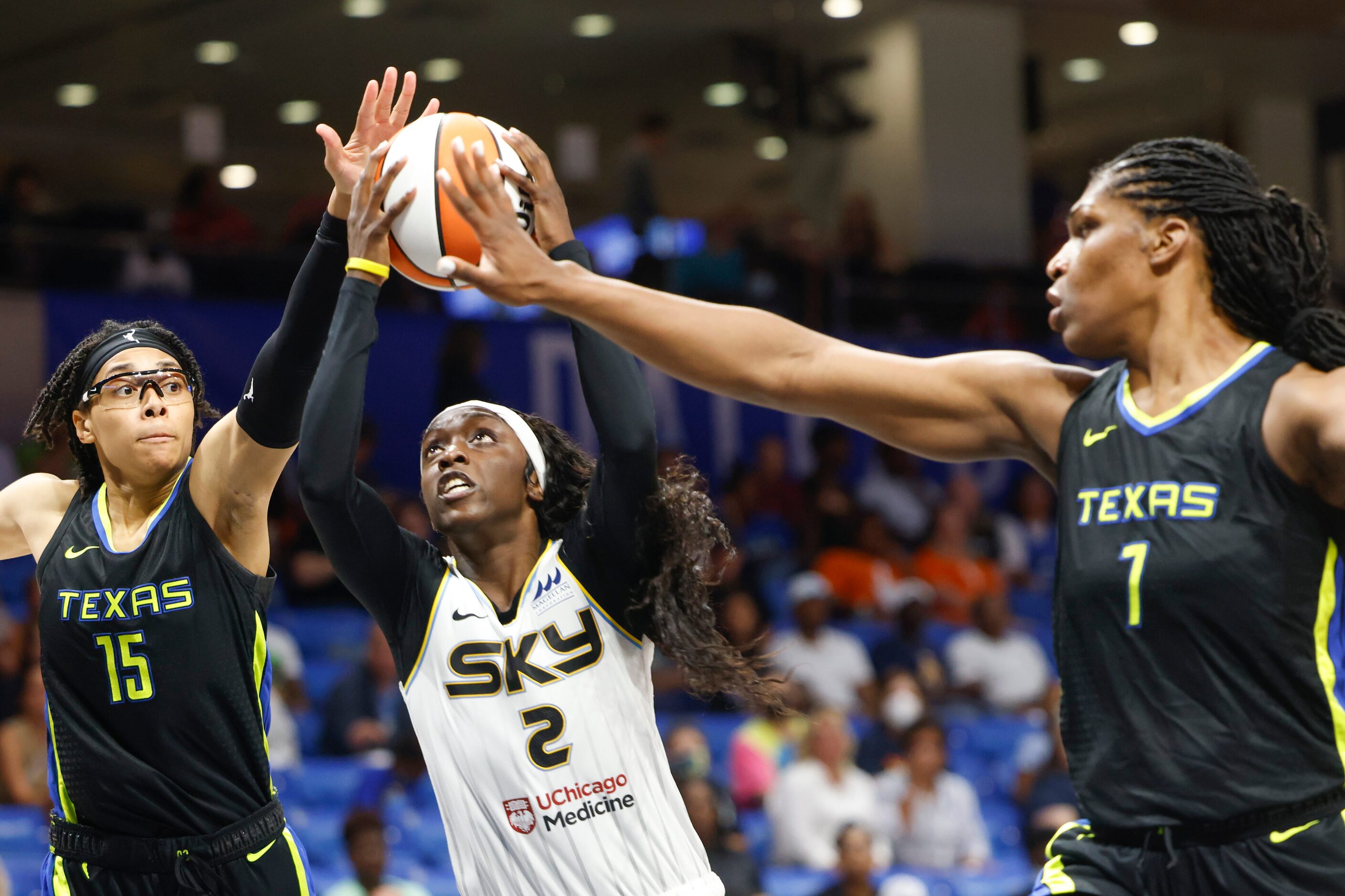 Dallas Wings center Teaira McCowan (7) and Dallas Wings guard Allisha Gray (15) attempts to...