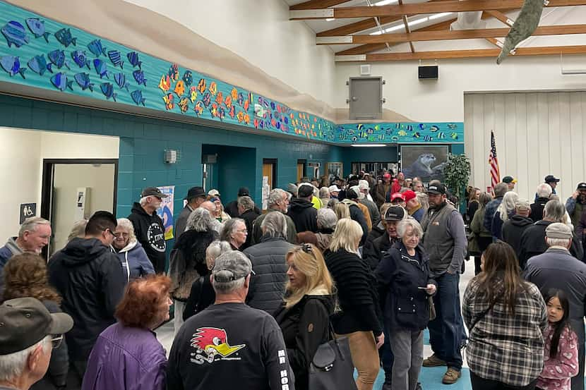 People wait for the caucus to begin at Spanish Springs Elementary School in Sparks, Nev.,...