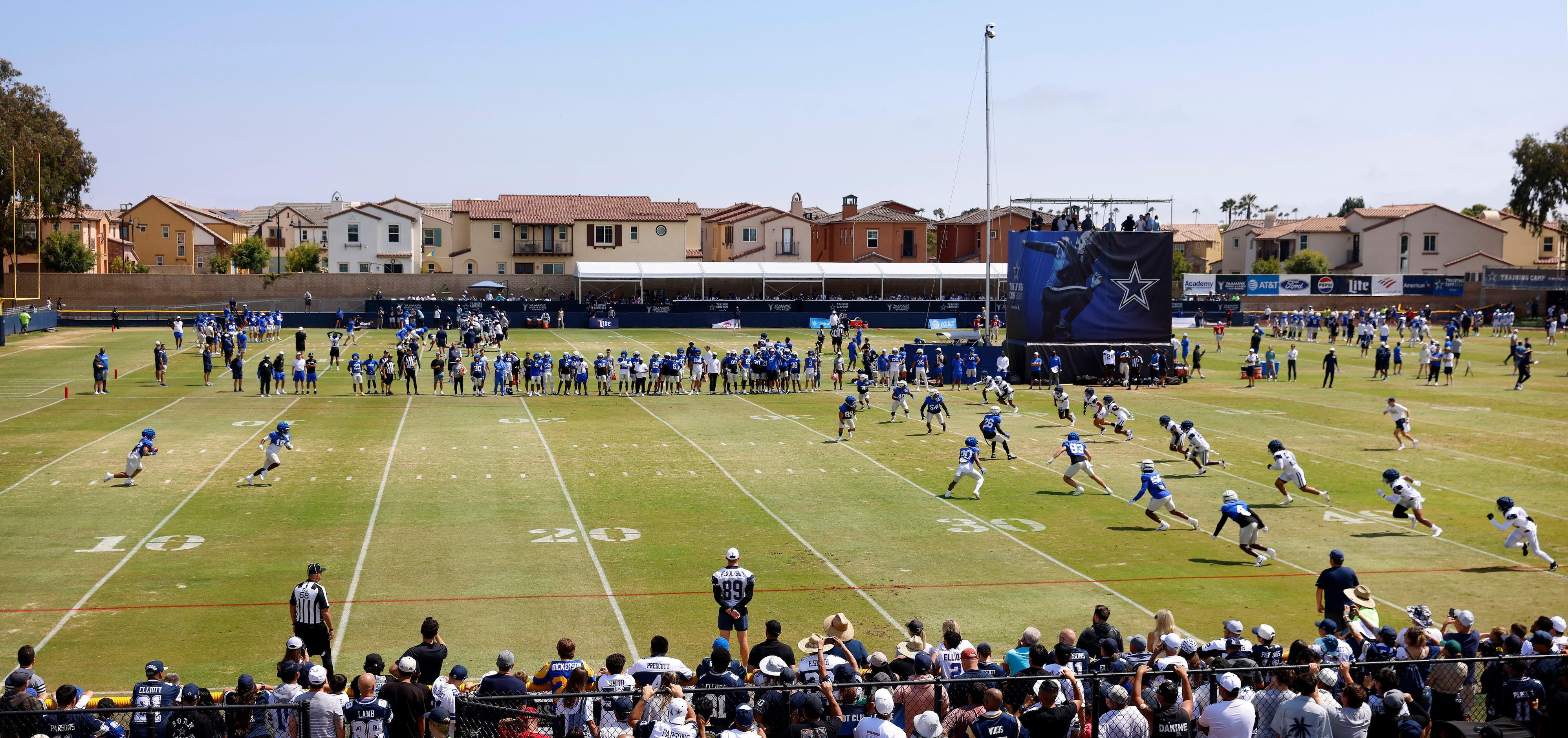 The Dallas Cowboys kick off to the Los Angeles Rams to practice the new rules during a...