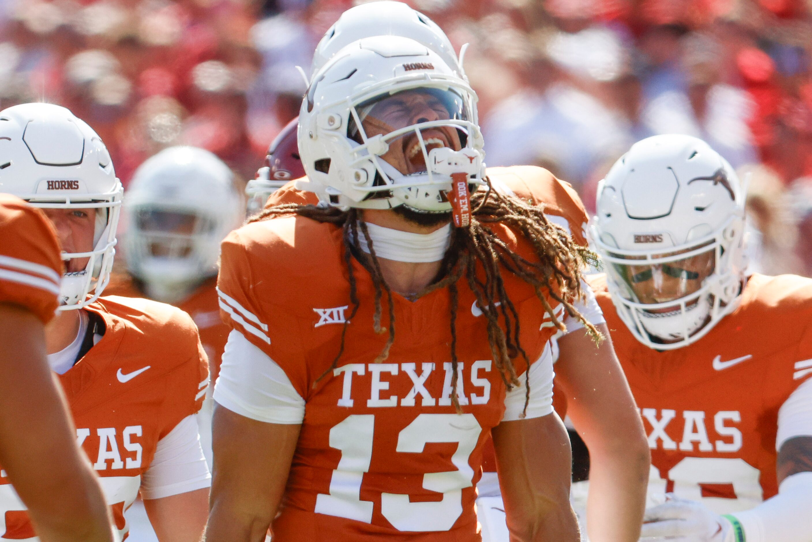 Texas wide receiver Jordan Whittington (13) cheers after a yardage against Oklahoma during...