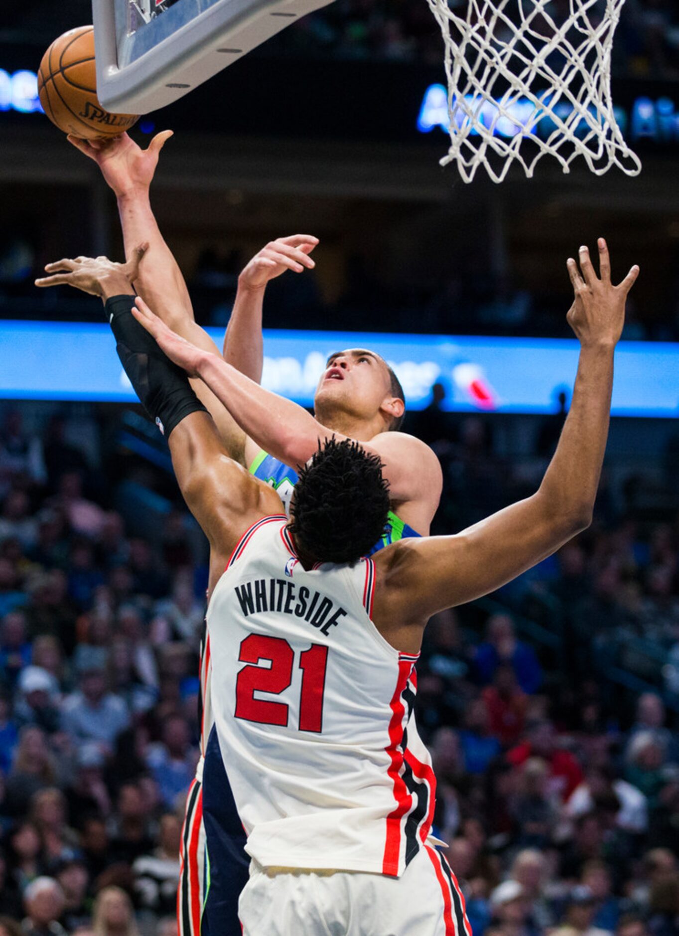 Dallas Mavericks forward Dwight Powell (7) goes up for a shot against Portland Trail Blazers...