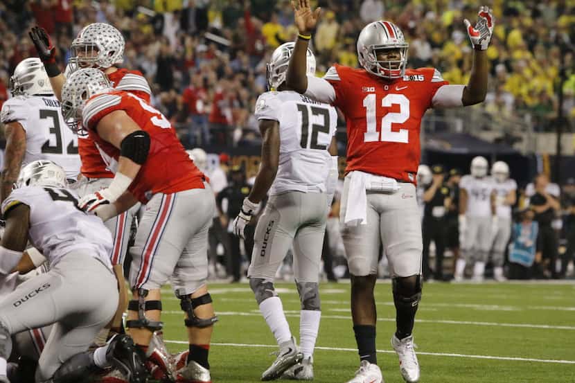 Ohio State Buckeyes quarterback Cardale Jones (12) celebrates a touchdown by running back...