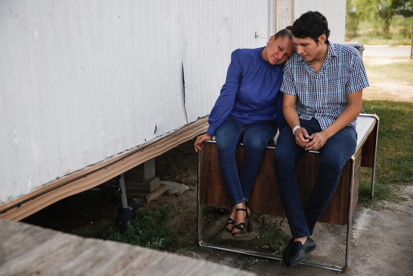 Sanjuana Galicia, left, leans in to her son Francisco's shoulder as they talk with each...