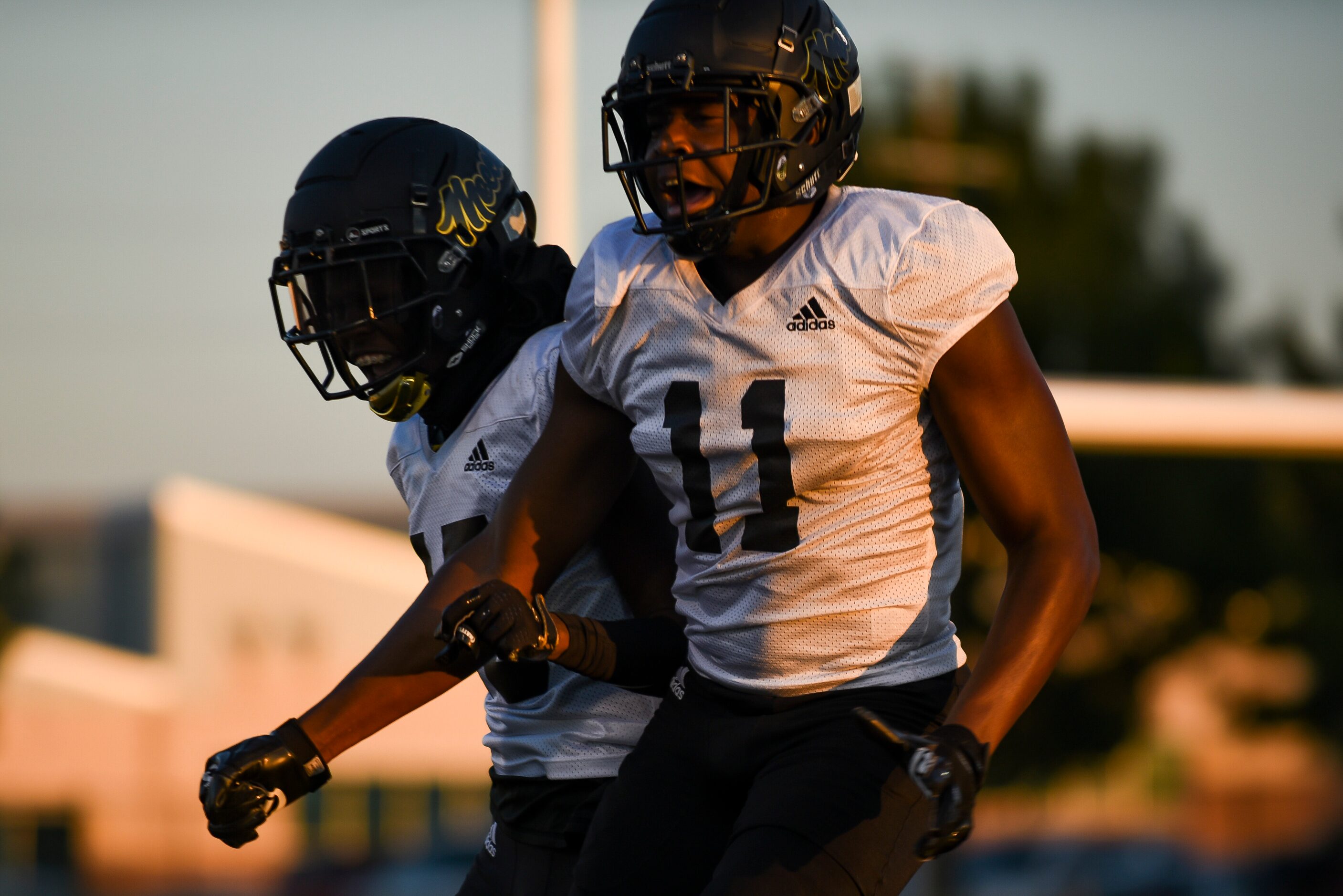 From left, South Oak Cliff junior Dave Eniis (15) celebrated with South Oak Cliff junior...