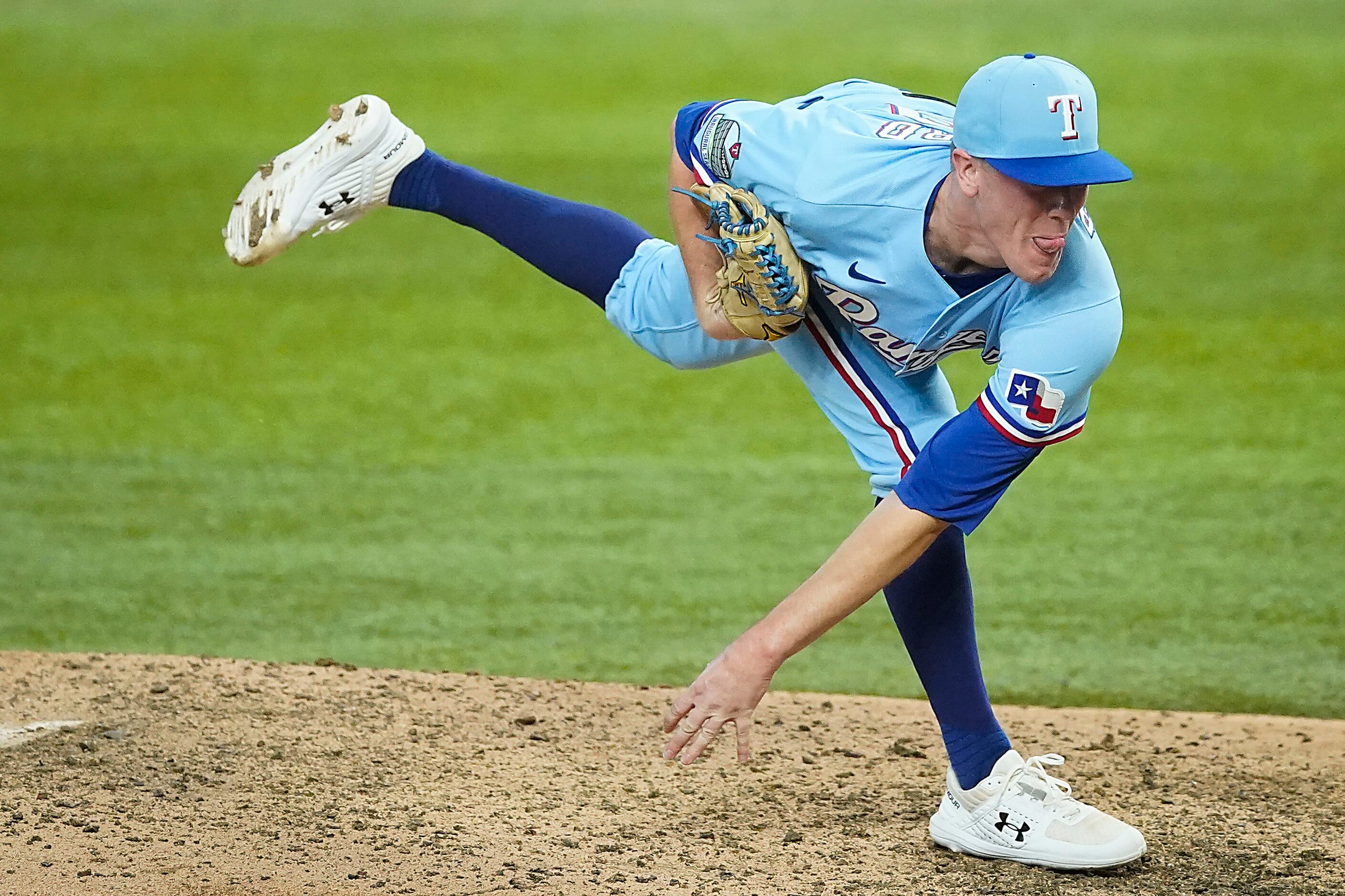 Texas Rangers pitcher Kolby Allard delivers during the seventh inning against the Houston...