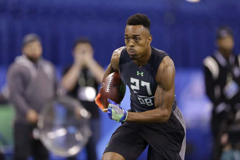 Houston defensive back William Jackson runs a drill at the NFL football scouting combine in...