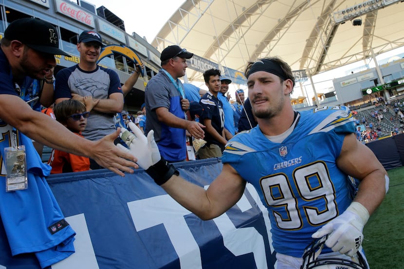 Los Angeles Chargers defensive end Joey Bosa greets fans after their win against the Denver...