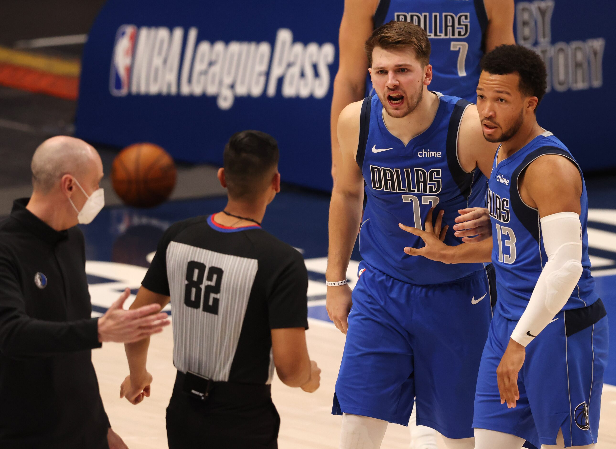 Dallas Mavericks guard Luka Doncic (77) questions a call from referee Suyash Mehta (82) as...