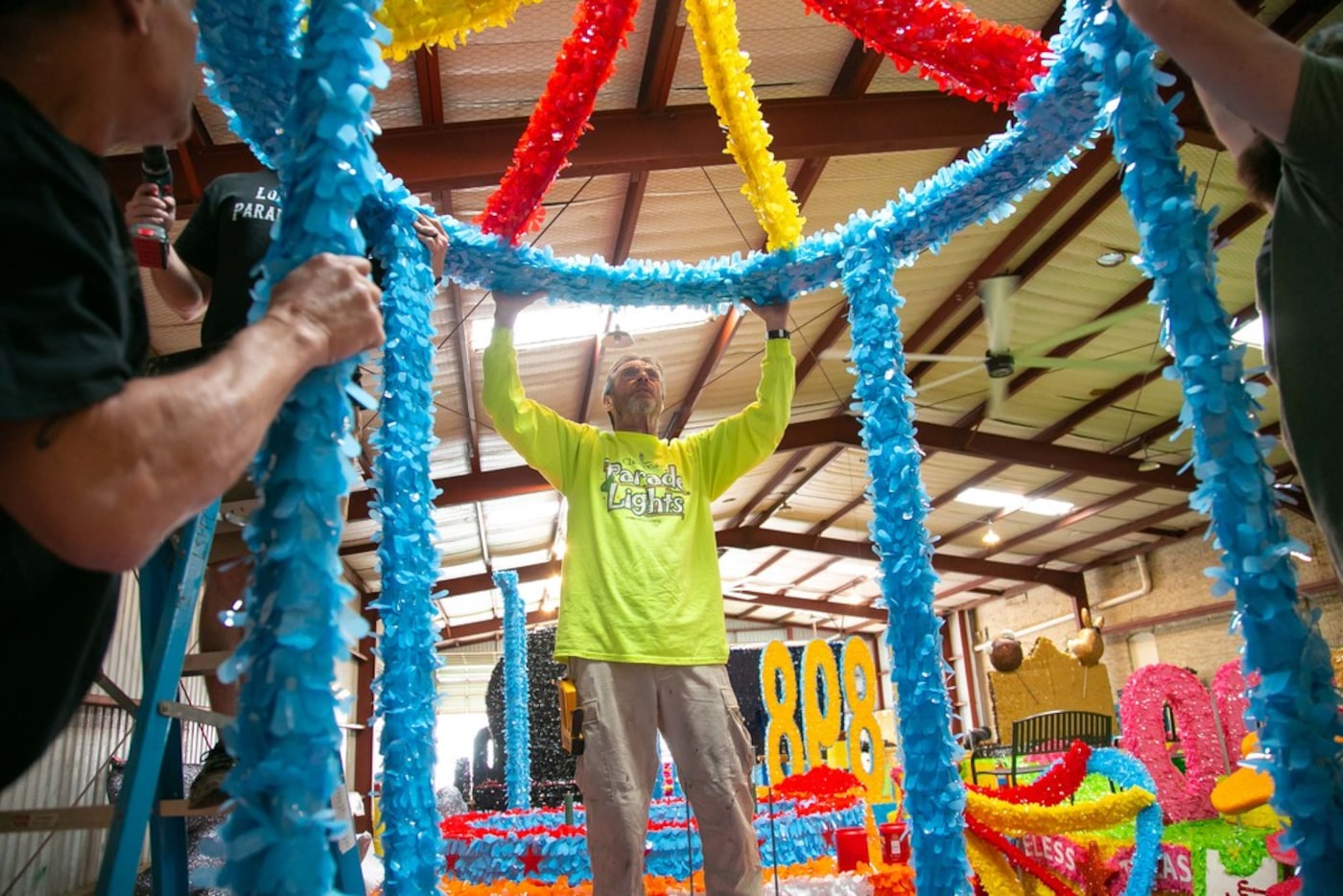 Clyde Watts of Dallas-based Lone Star Parade Floats works on the Whataburger-themed float...